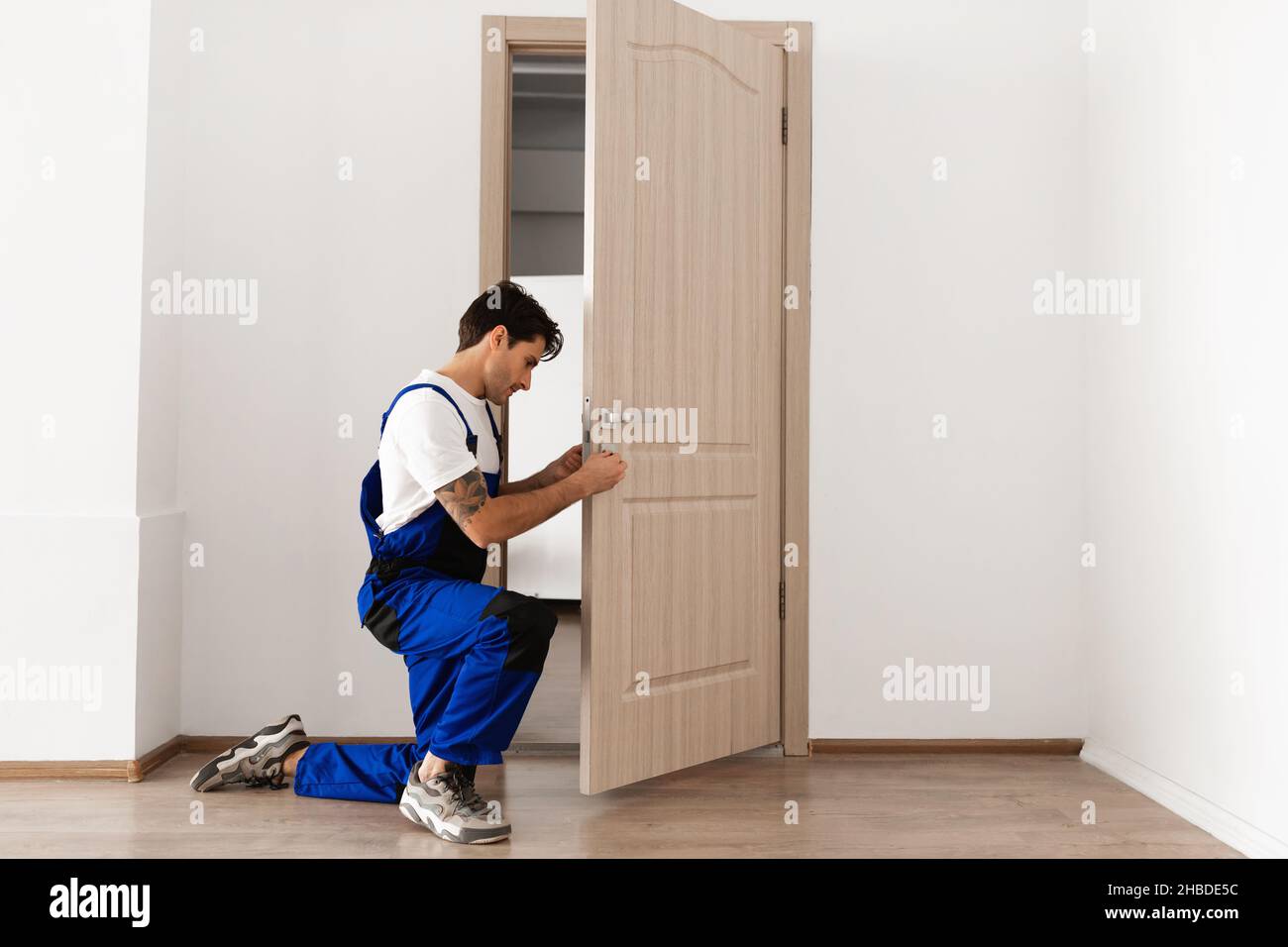 Picture of Installation of a lock on the entrance door Stock Photo - Alamy