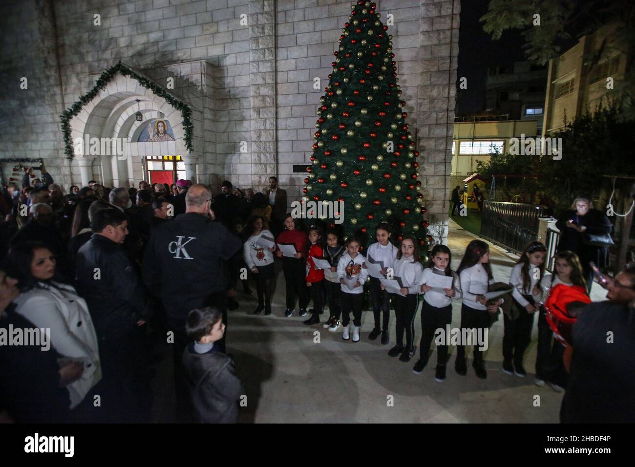 Palestinian Christian worshipers in the Roman Catholic Holy Family Church during the start of the Christmas holiday, in Gaza City, on Dec 18, 2021. Stock Photo