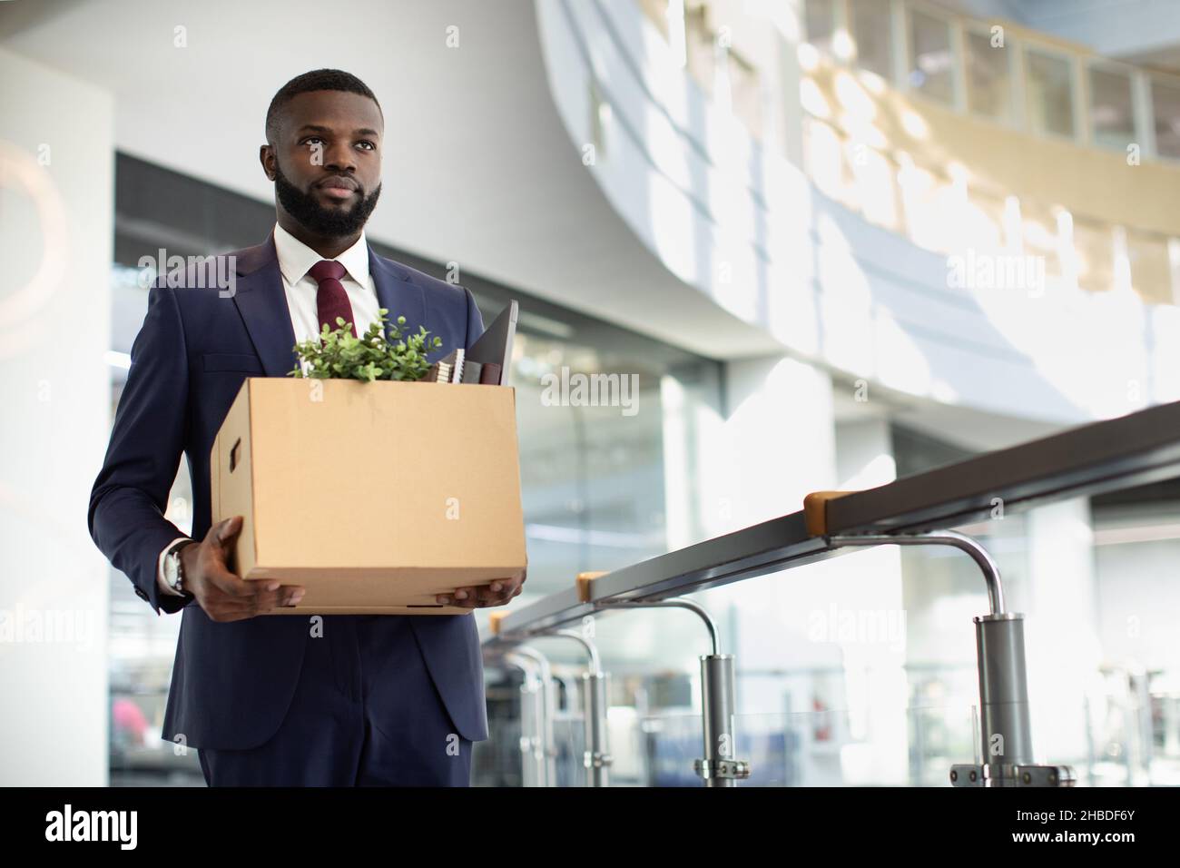 Motivated african american young man in suit with working stuff Stock Photo