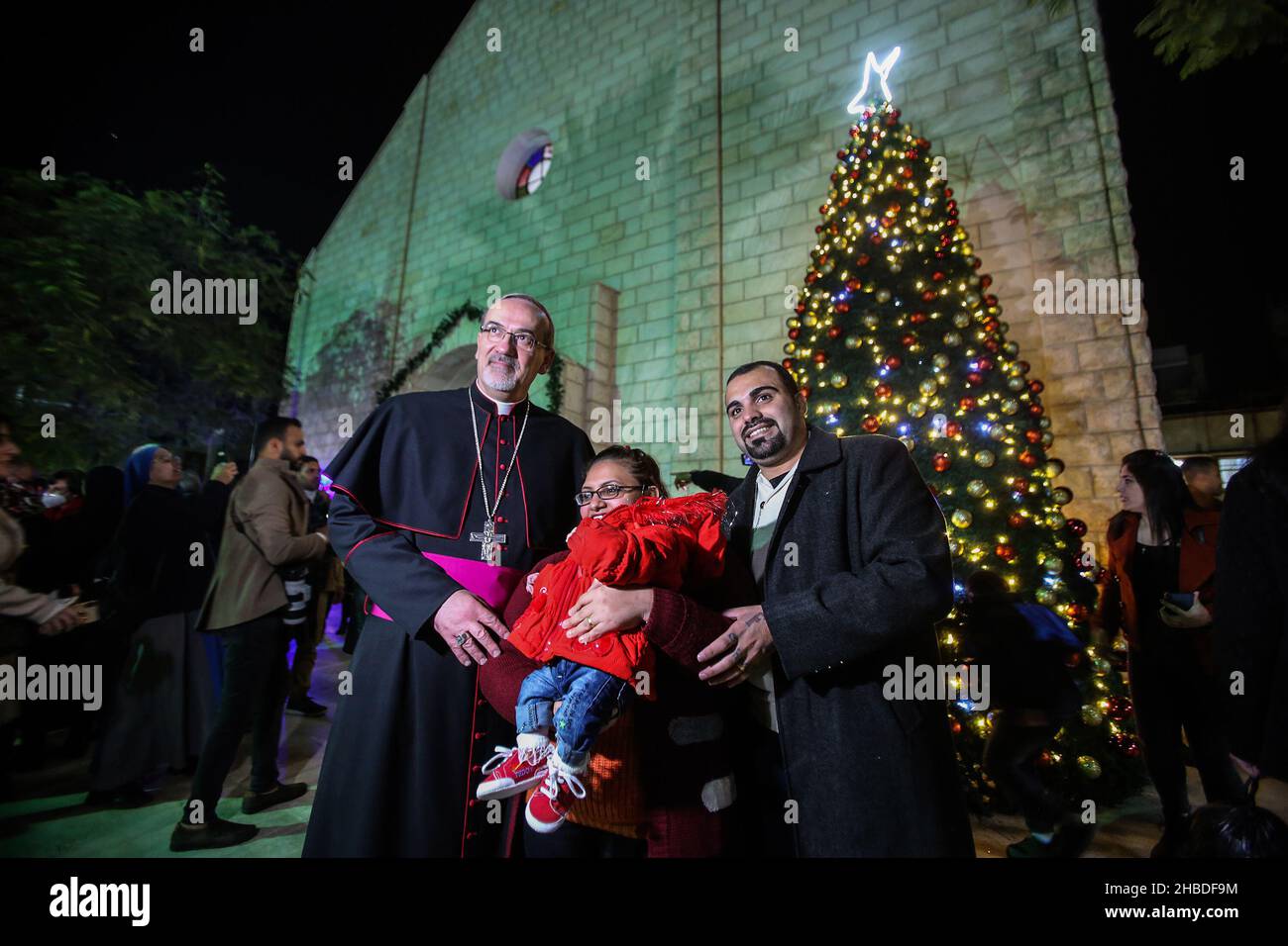 Palestinian Christian worshipers in the Roman Catholic Holy Family Church during the start of the Christmas holiday, in Gaza City, on Dec 18, 2021. Stock Photo