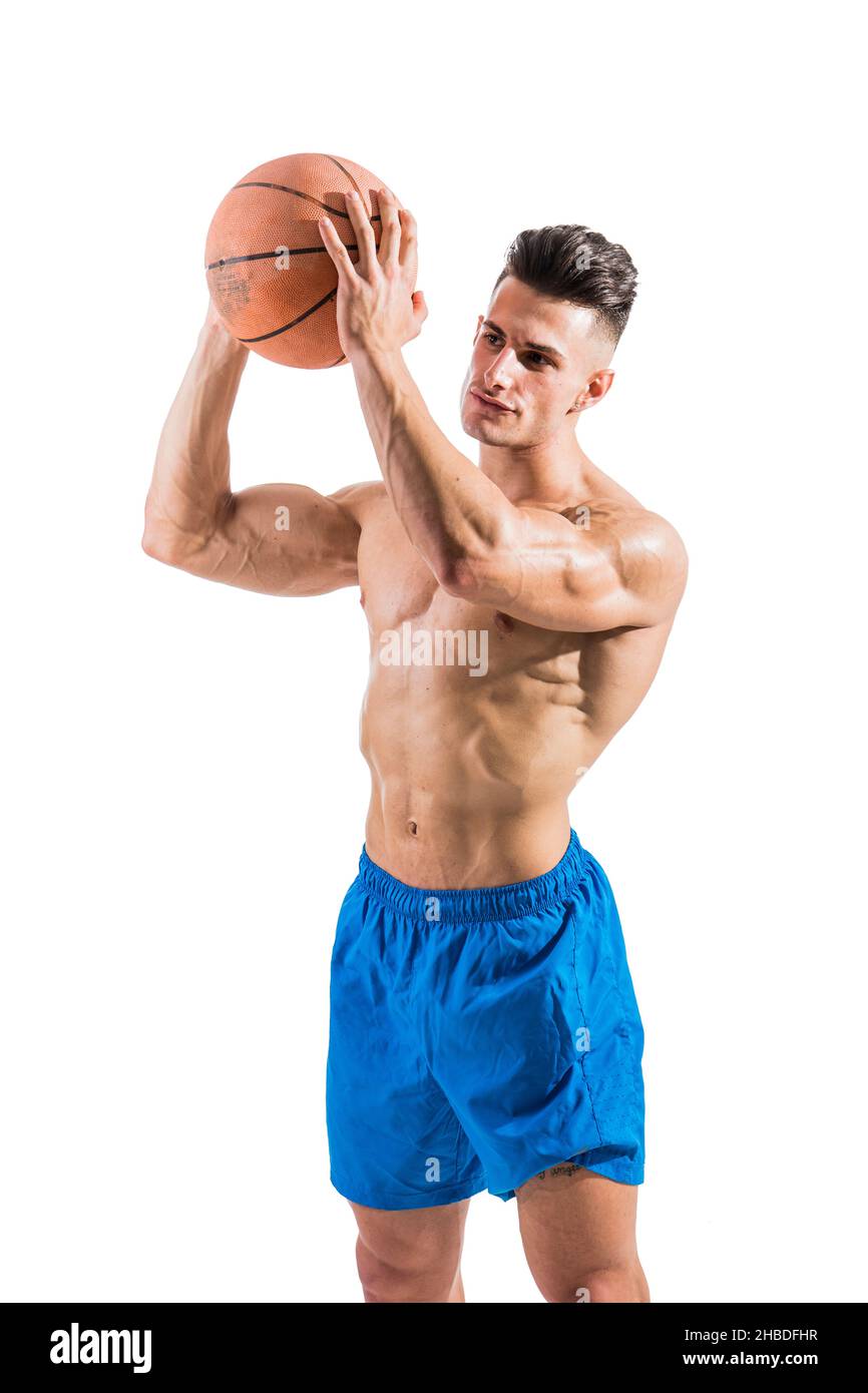 Muscular blond shirtless male model throwing basketball ball Stock Photo