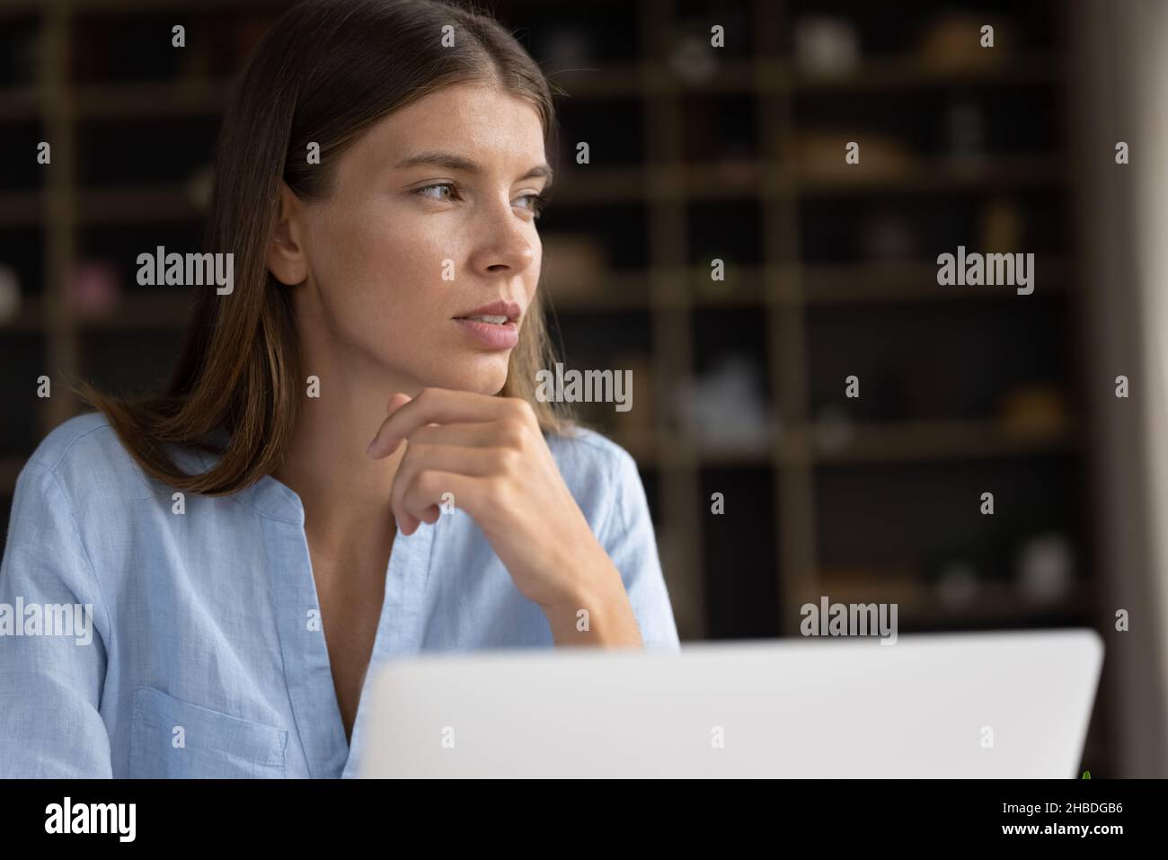 Smiling dreamy young pretty woman visualizing future at home Stock ...