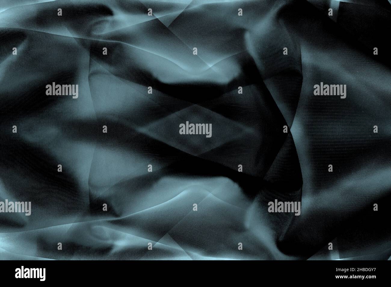 Abstract dark moody twisted silk fabric for background Stock Photo
