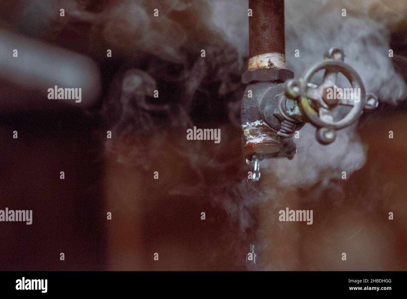 The broken valves leaking water and vapor Stock Photo Alamy