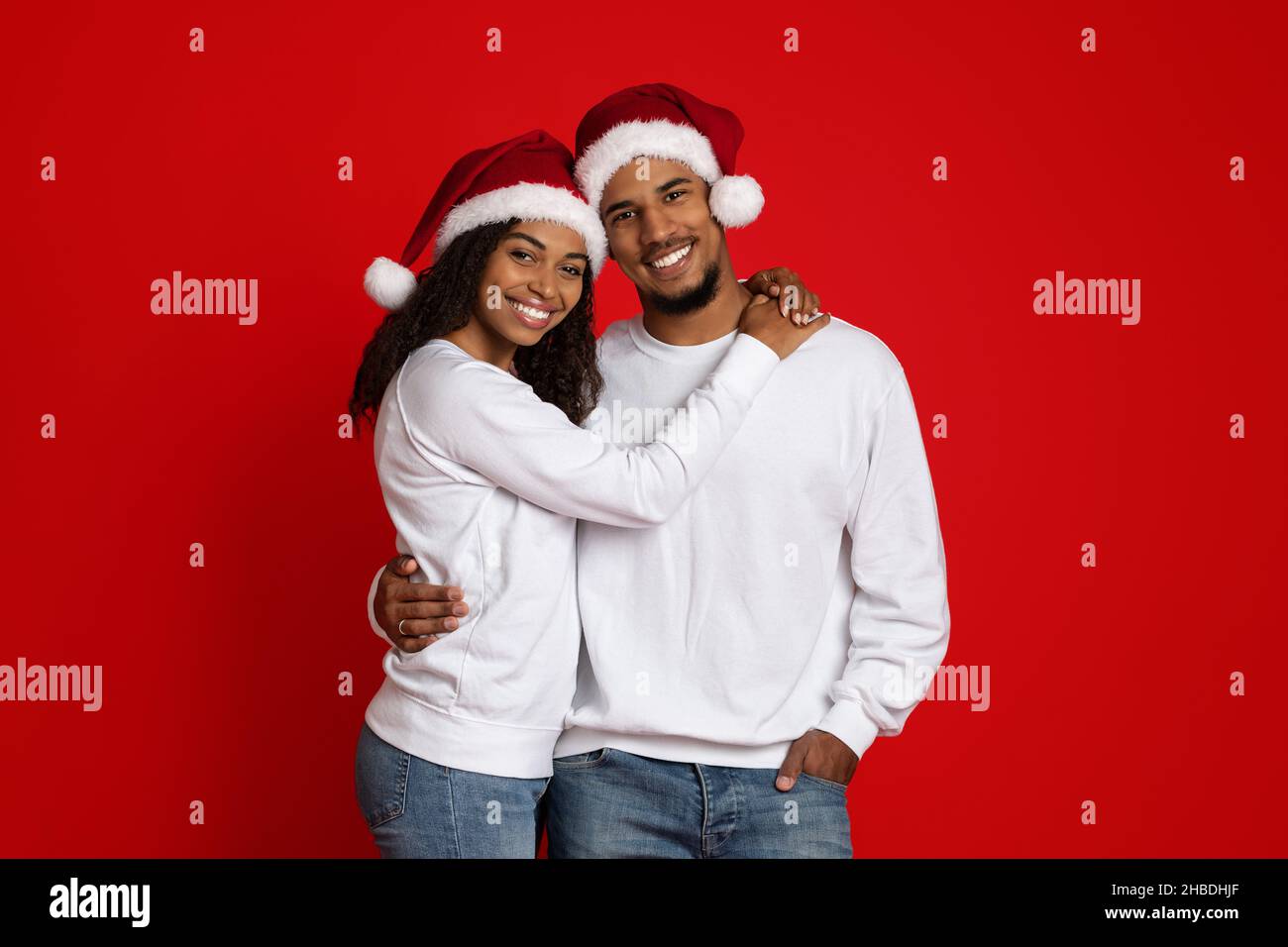 Loving african american woman hugging her cheerful boyfriend Stock ...