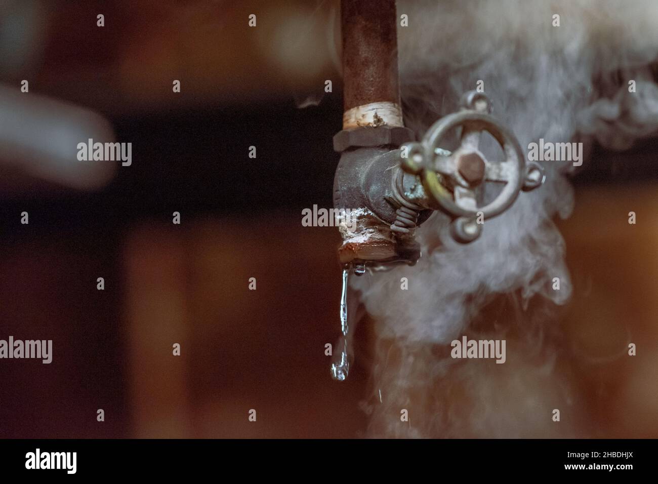 The broken valves leaking water and vapor Stock Photo Alamy