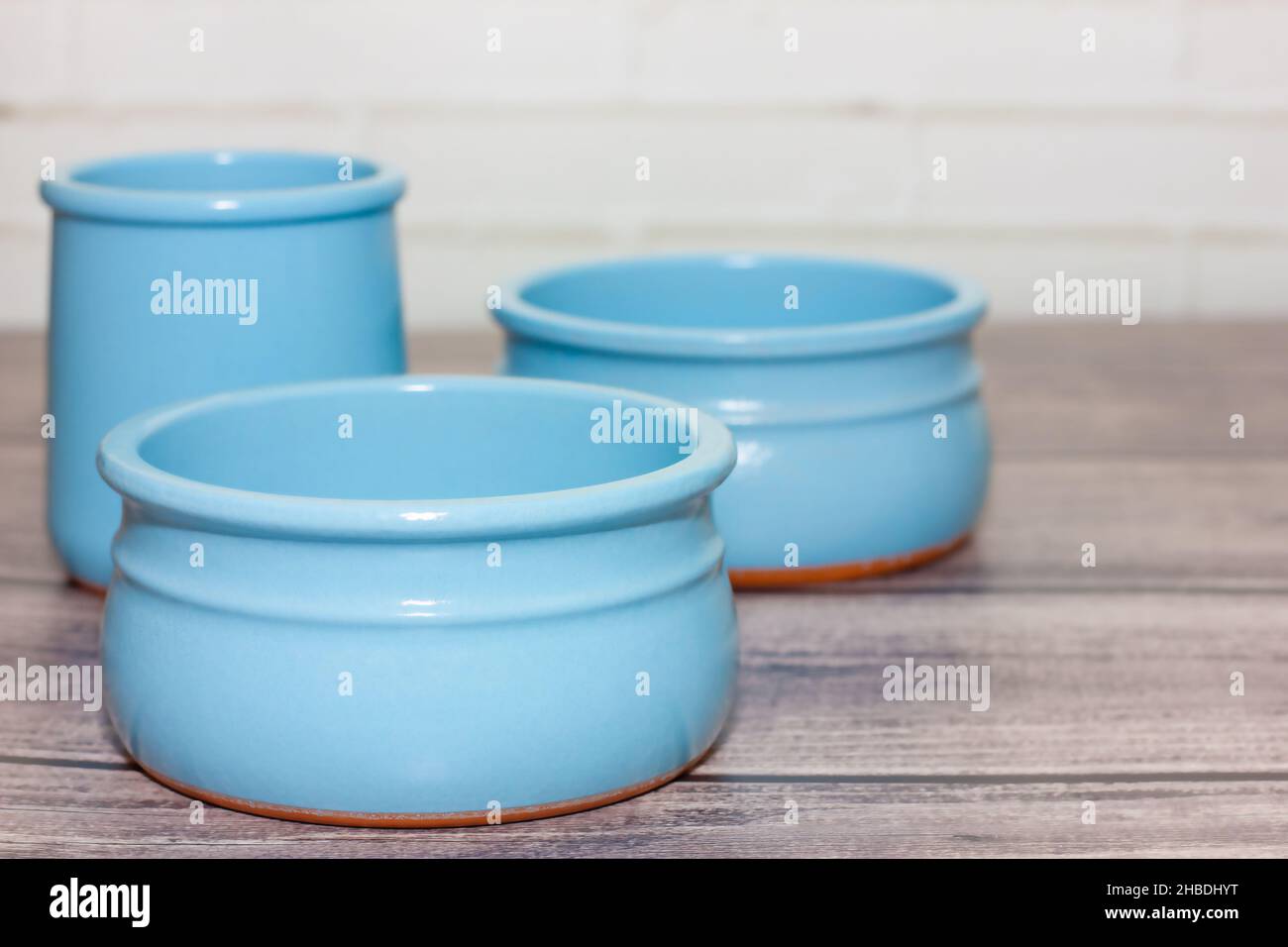 clean empty ceramic blue bowls on wooden background. Stock Photo