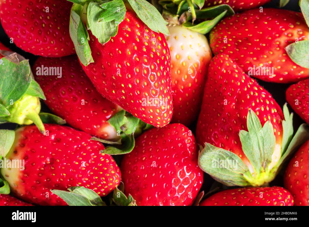 fresh and ripe strawberries background closeup Stock Photo - Alamy