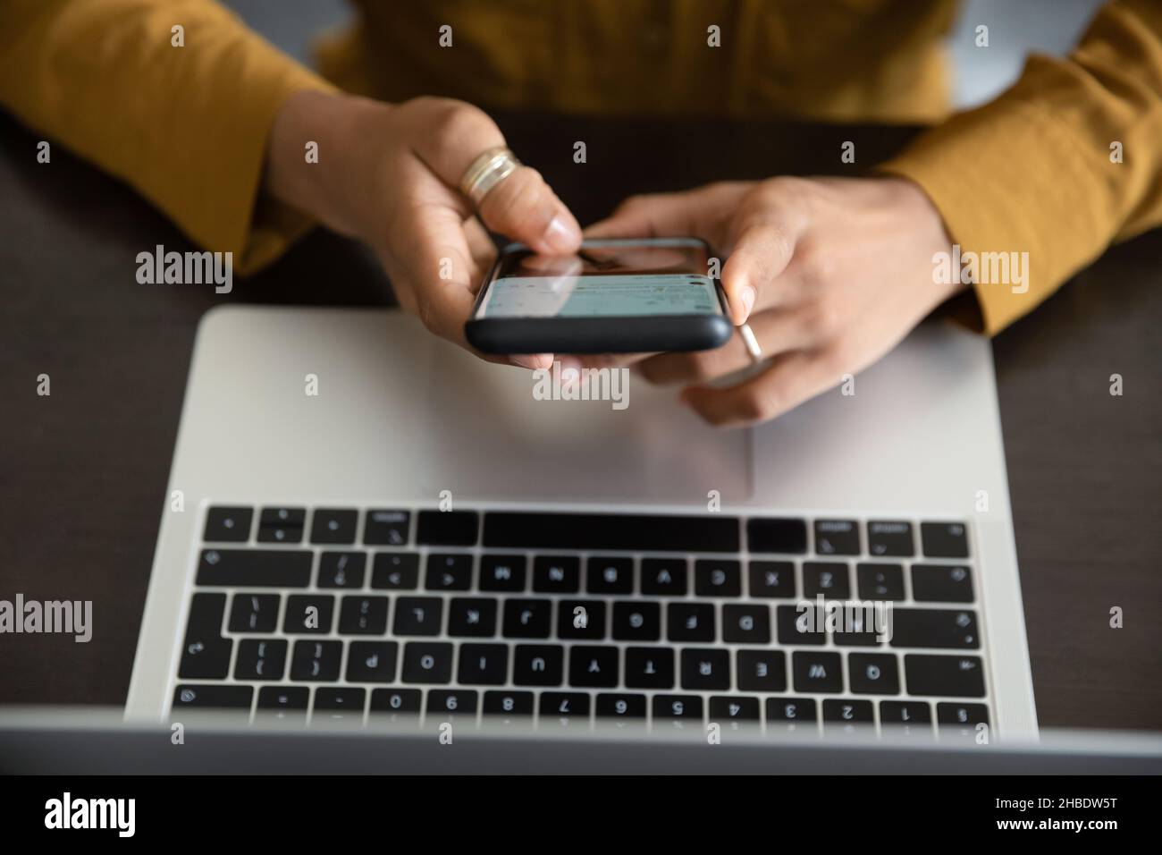 Above top view young woman using cellphone. Stock Photo