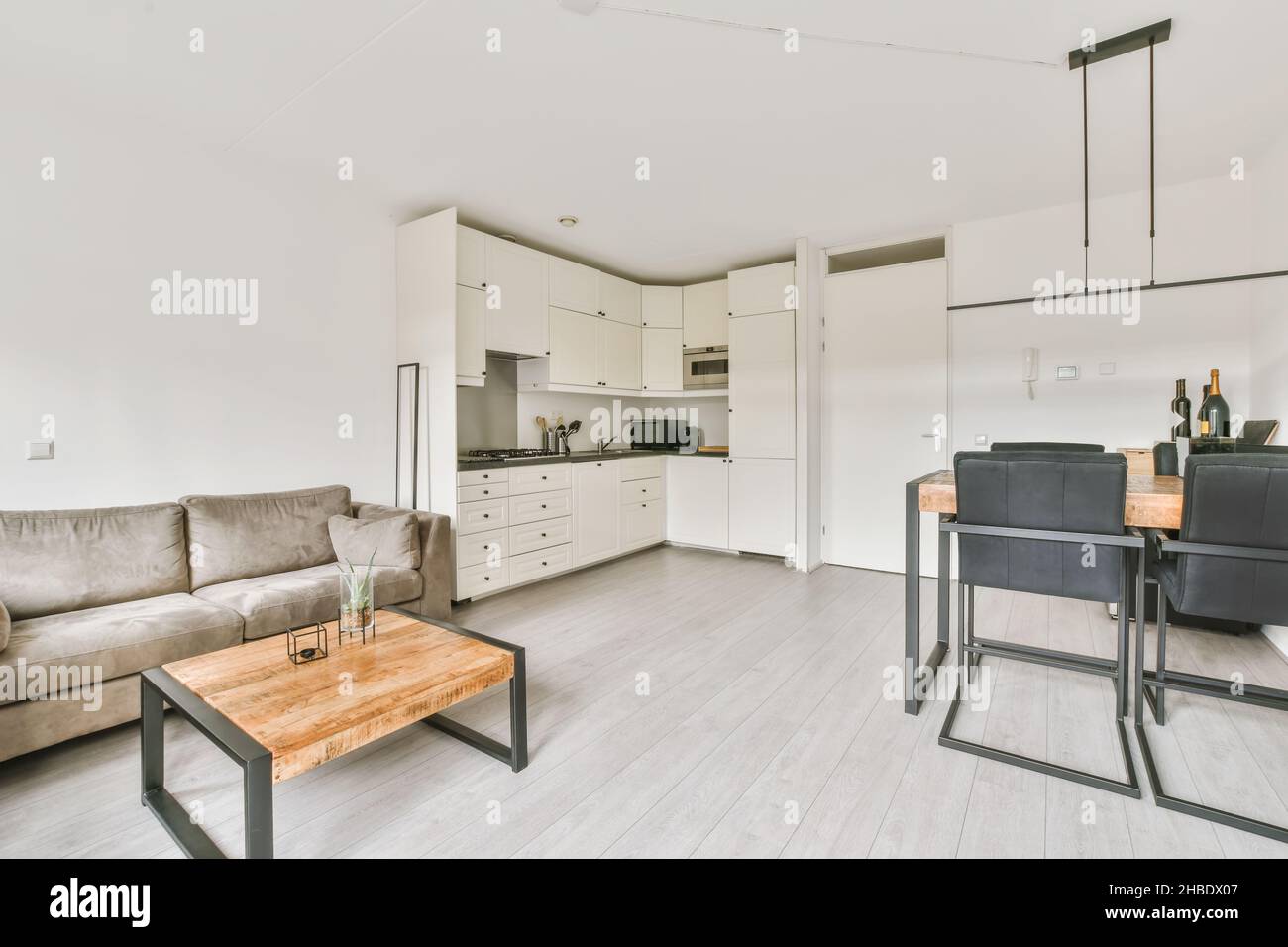 Cozy studio room combined living room, dining room and kitchen in a minimalist style Stock Photo