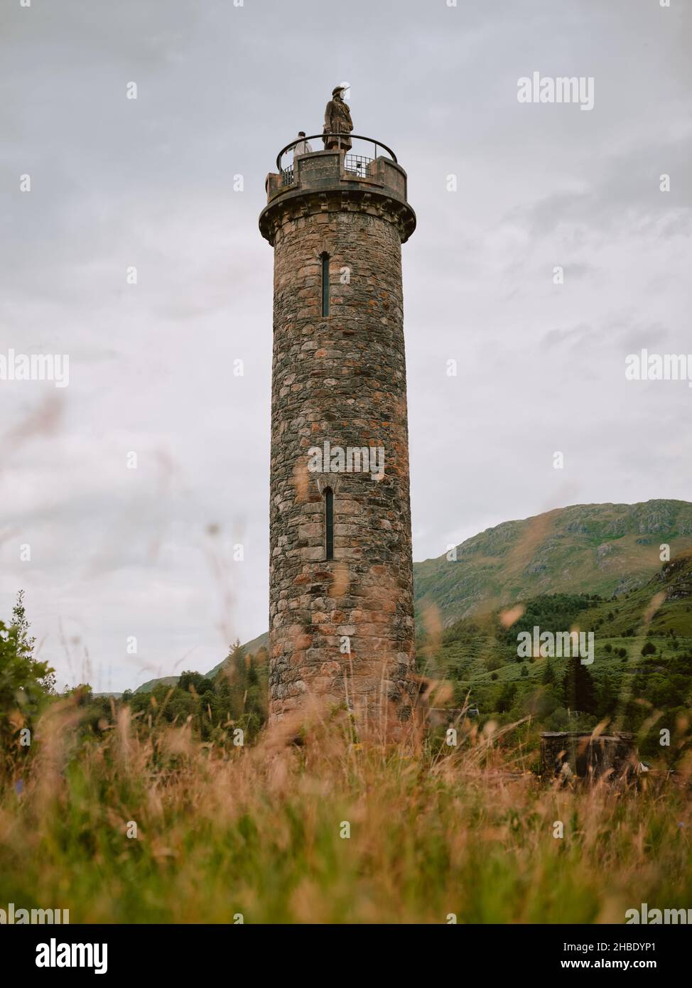 The Glenfinnan Monument & Tourist Attraction in Lochaber, Ardnamurchan and The West Highlands in Scotland UK - Scottish architecture tourism Stock Photo