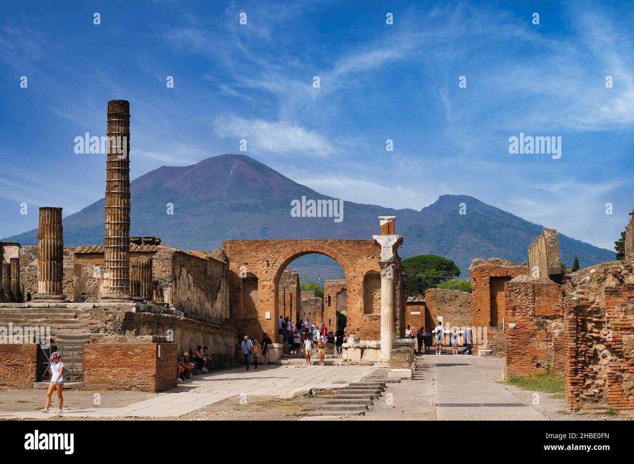 Forum of Pompeii destroyed by the eruption of the volcano Vesuvius, view of the forum and Temple of Jupiter with Mount Vesuvius in the background Stock Photo