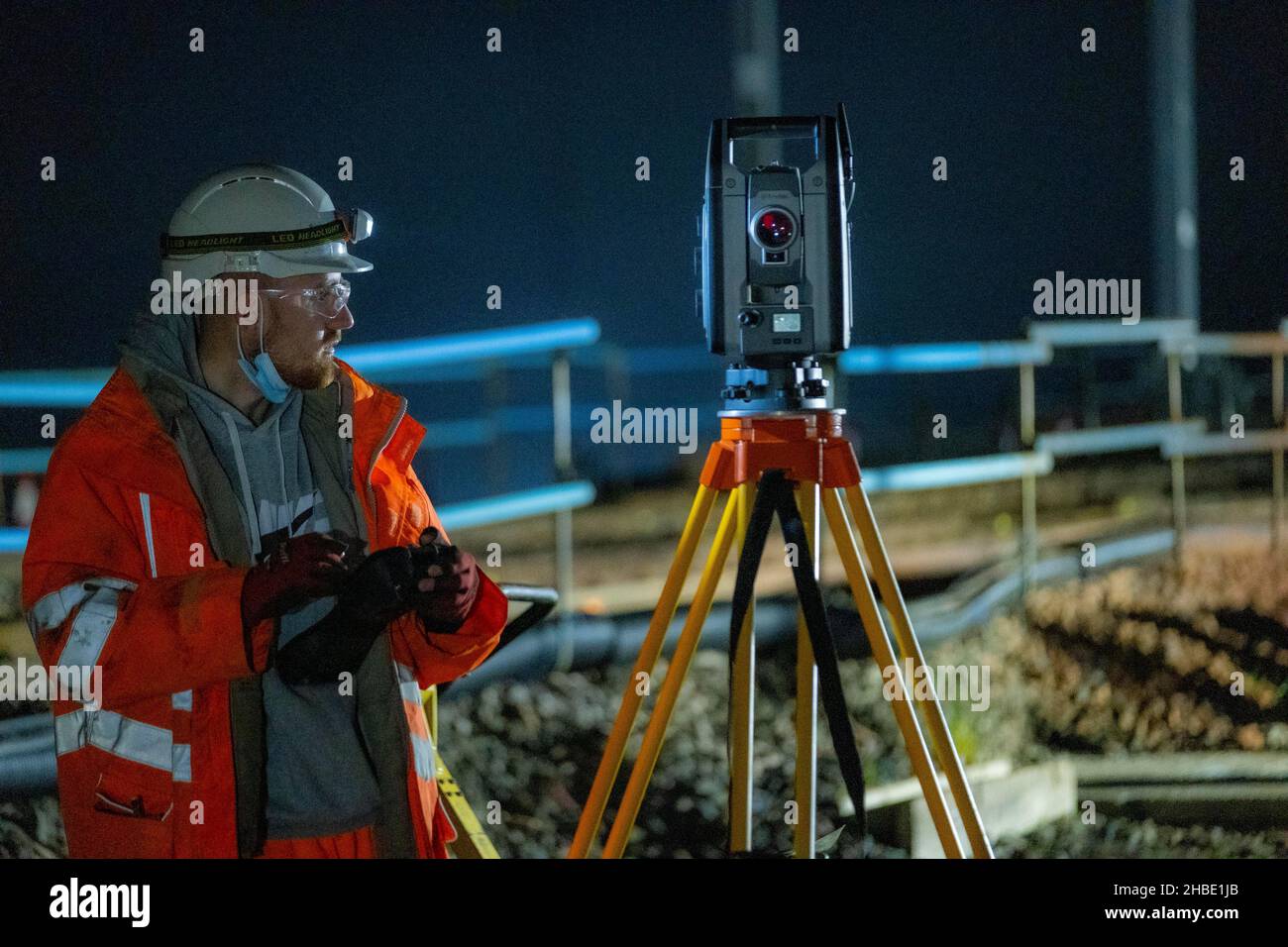 Railway workers building new railway and knocking down bridges Stock Photo