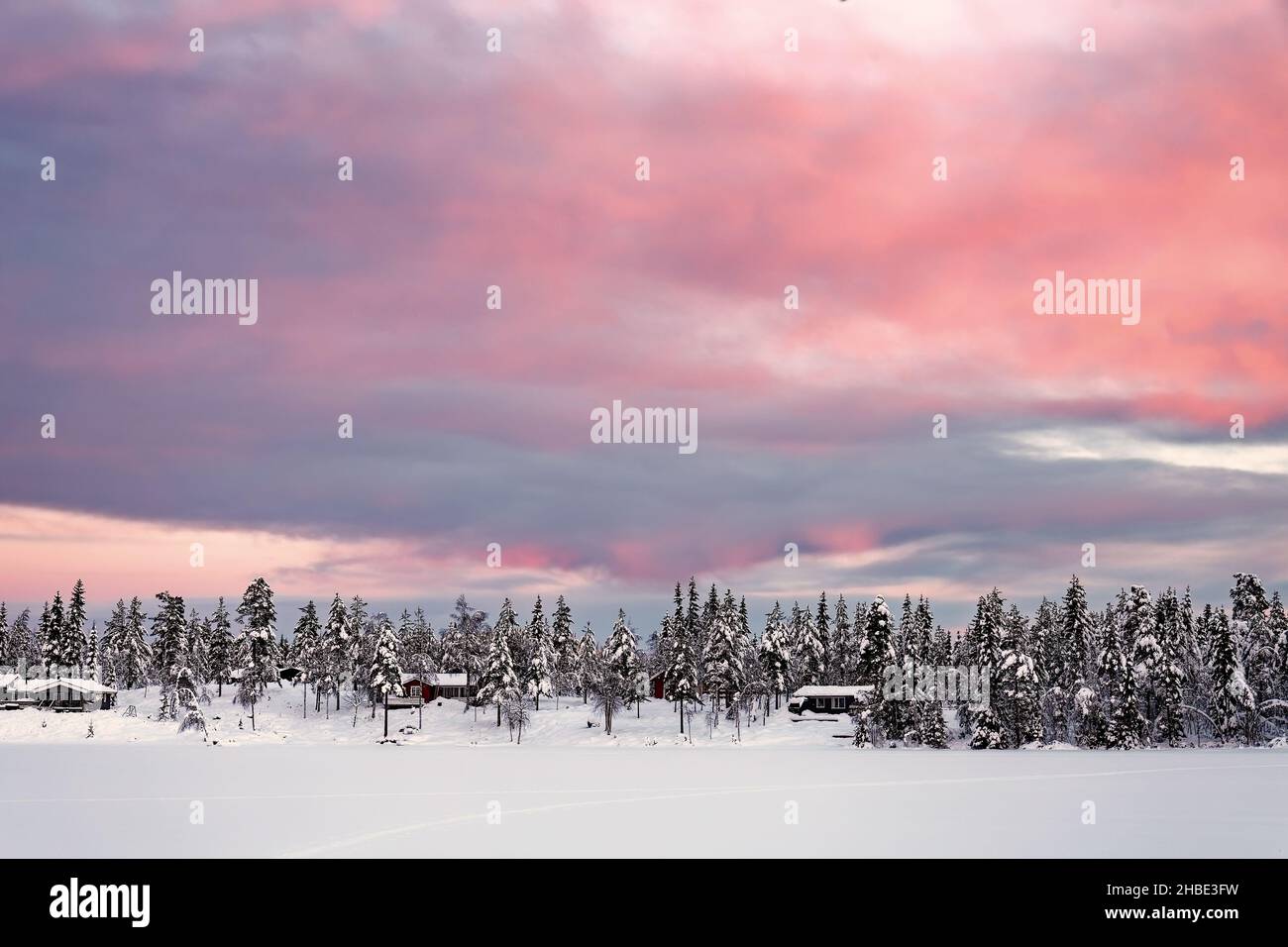 Colorful sunset over winter landscape with snow covered forest . Winter ...