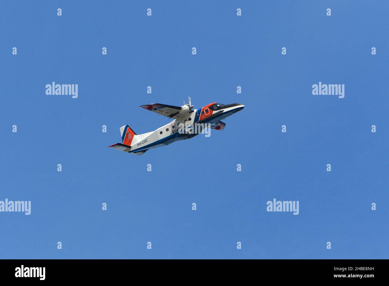 Airplane, twin engined Dornier Do-228-212 patrol plane in flight from the Dutch coastguard, island of Texel, Holland, Europe Stock Photo