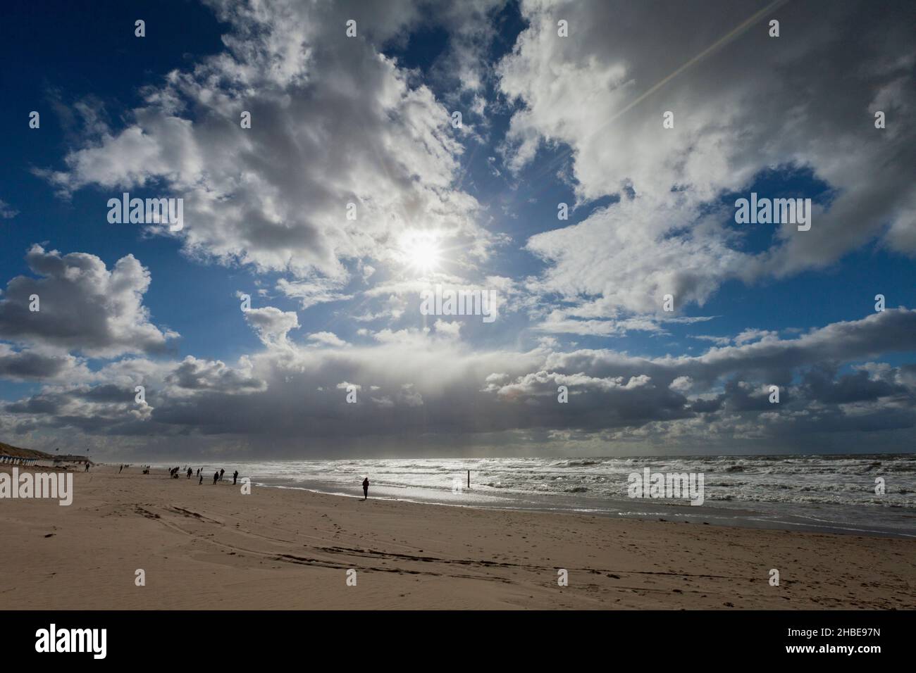 People walking on beach, on the West coast of the Island Texel, beside the town of De Koog, Holland, Europe Stock Photo