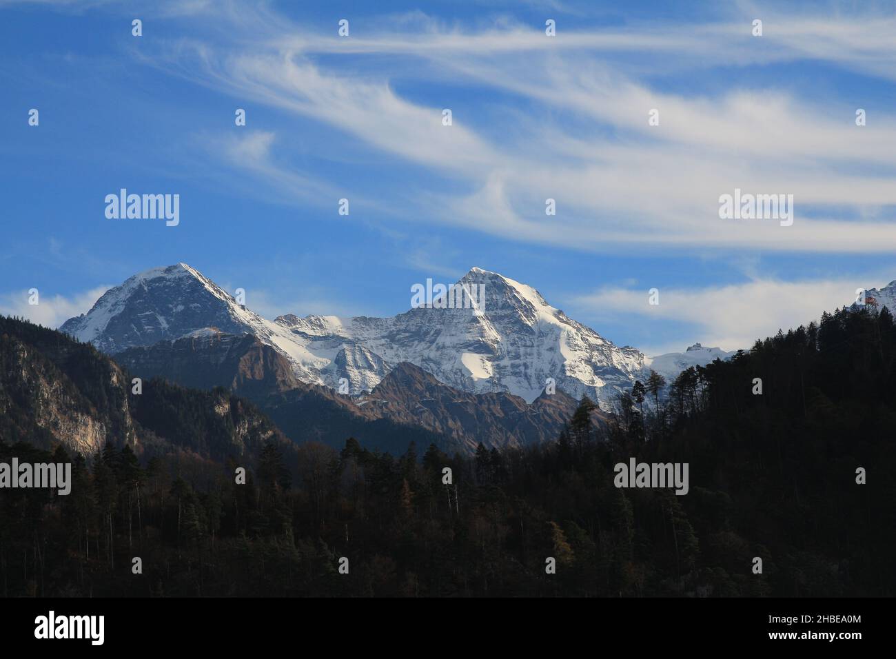 Famous mountains Eiger and Monch seen from Interlaken Stock Photo - Alamy