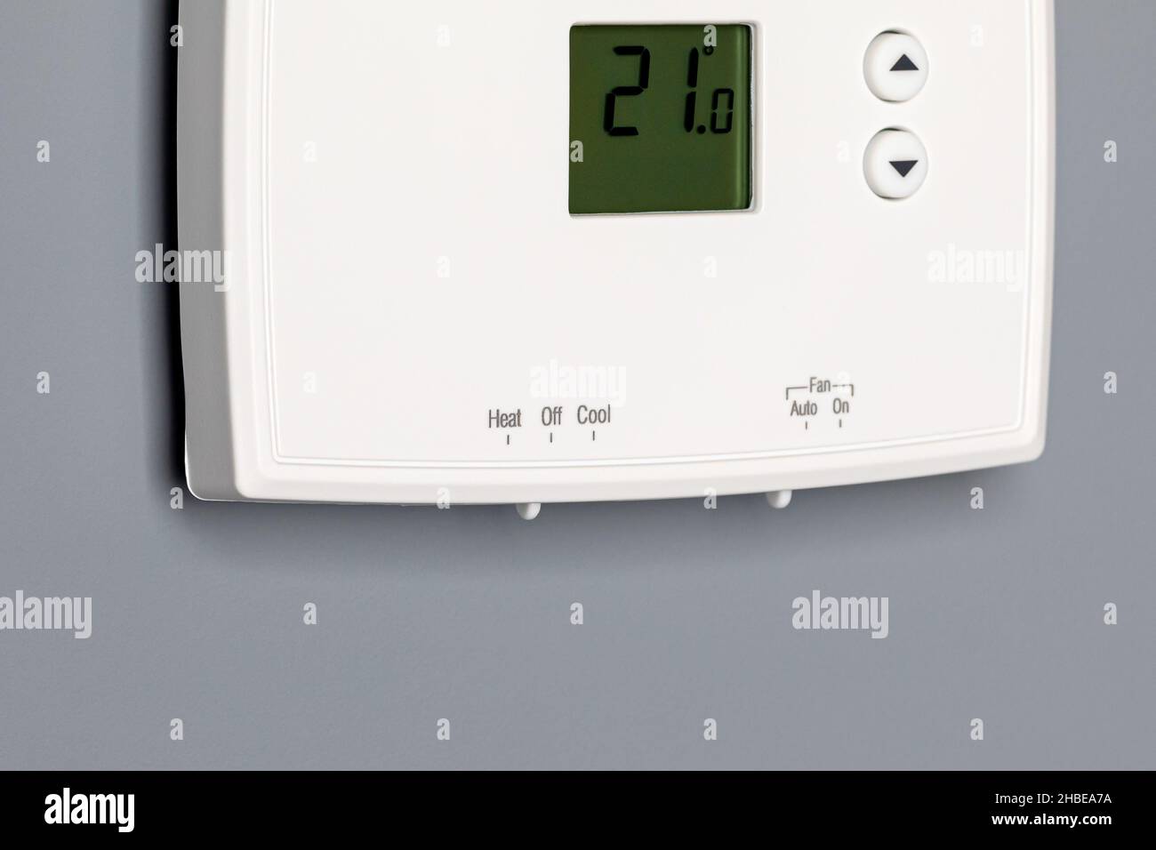 Celsius thermostat for home furnace and air conditioner. Utility bill savings, energy cost and conservation concept Stock Photo