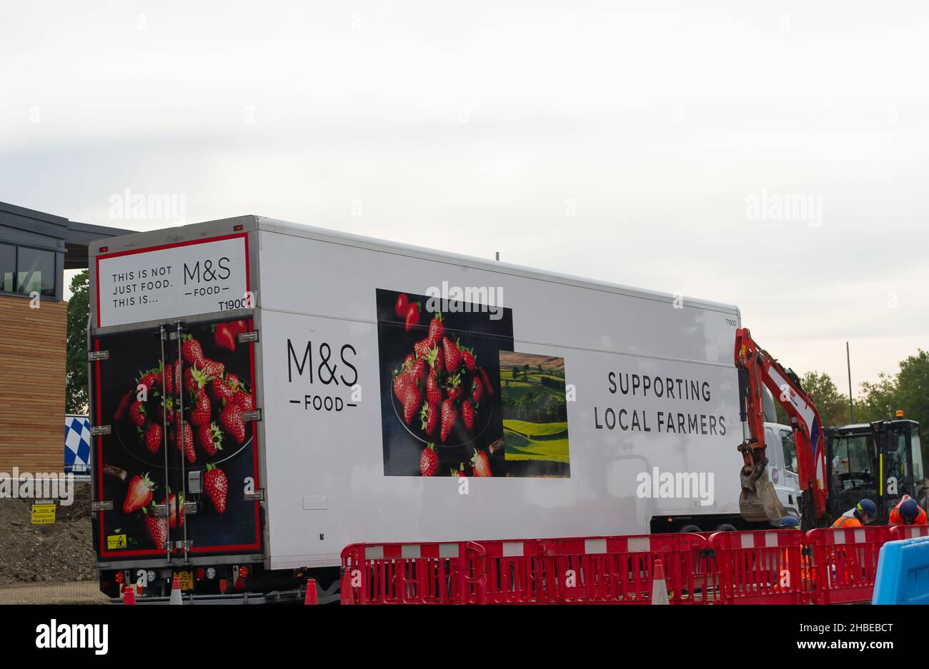 Aylesbury, Buckinghamshire, UK. 11th October, 2021. A huge M&S articulated lorry passes a new Sainsbury's store in Aylesbury. Credit: Maureen McLean/Alamy Stock Photo