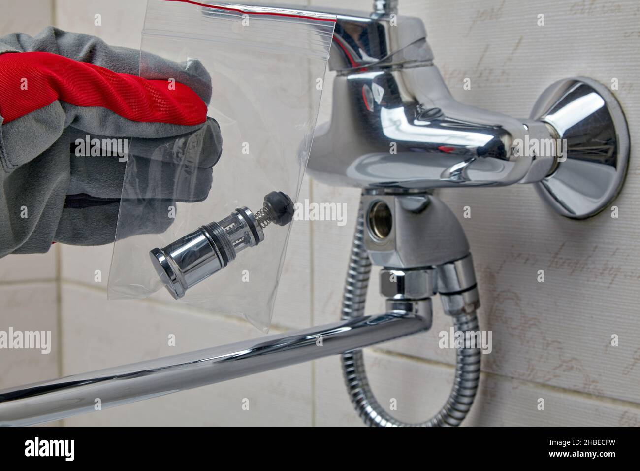 Repair of the plumbing switch of the shower valve Stock Photo Alamy