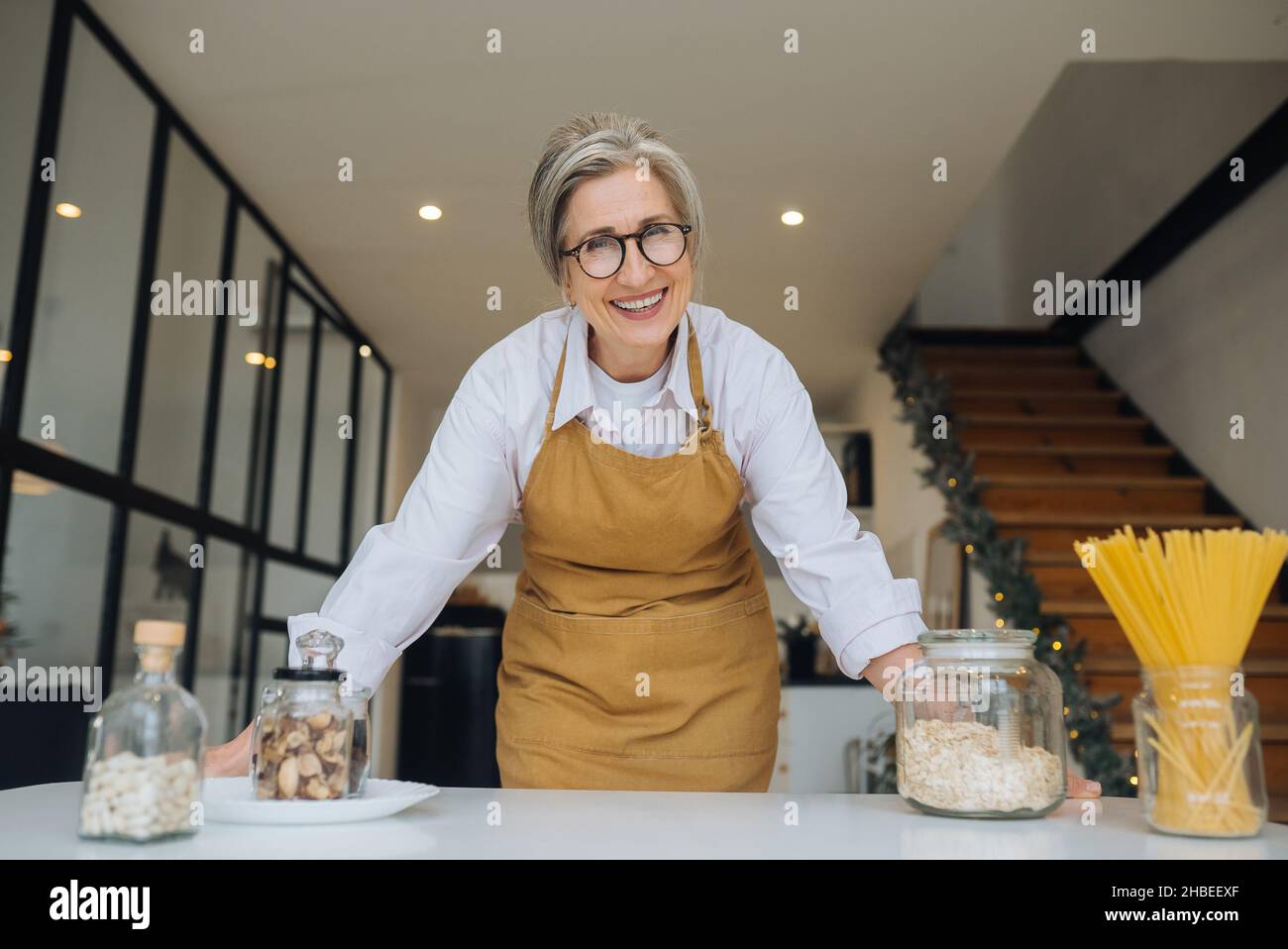 Smiling middle aged mature grey haired woman looking at camera Stock ...