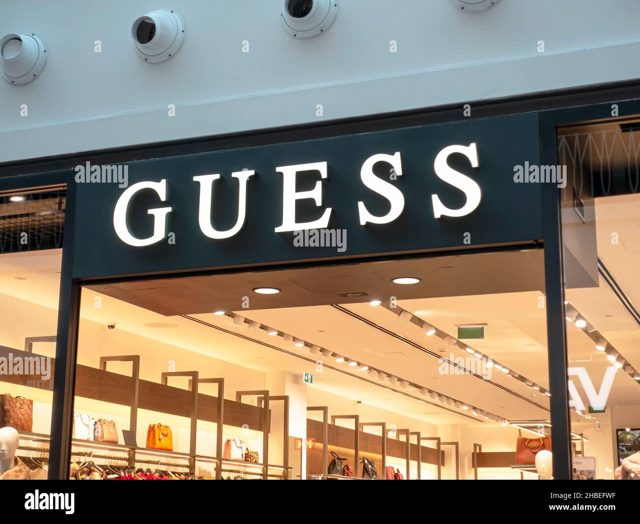 Funchal, Portugal - Oct 23, 2021: Guess store sign. Guess is an American clothing brand and retailer Stock Photo