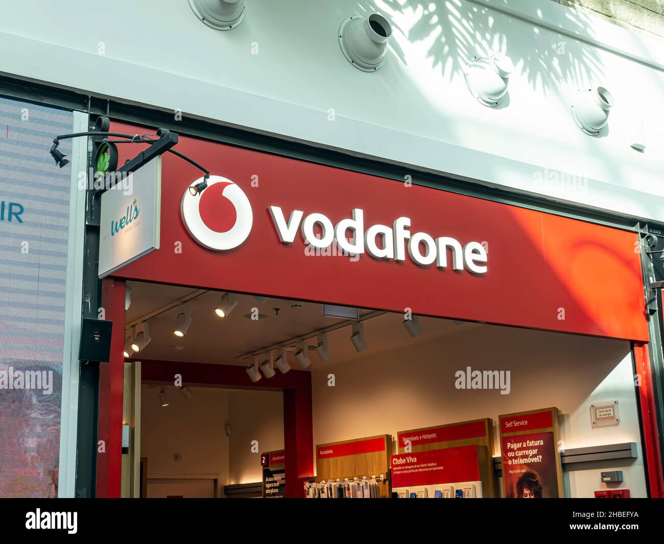 Funchal, Portugal - Oct 23, 2021: Vodafone store sign. Vodafone is a British multinational telecommunications company. Stock Photo