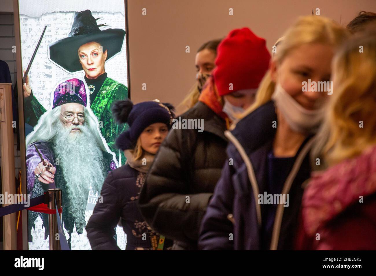 Moscow, Russia. 19th December, 2021 People stay in a queue at the Harry Potter pop-up shop at the Central Children's Store in Lubyanka Square in Moscow; the store sells Harry Potter branded toys, stationery, clothing, souvenirs, sweets and other merchandise Stock Photo