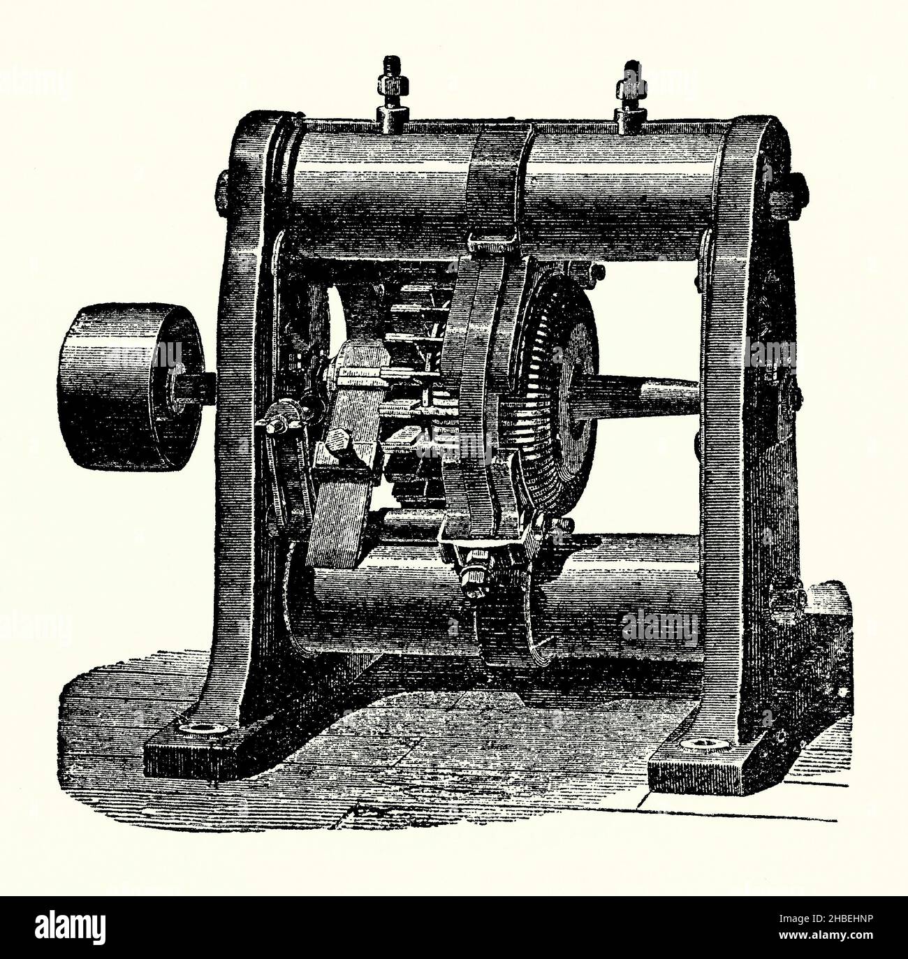 An old engraving of a magneto-electric device of the mid-1800s. It is from a Victorian book of the 1890s on discoveries and inventions during the 1800s. This particular device has horizontal electro-magnets. It was used for producing power rather than for lighting. It is based on a Gramme machine (Gramme ring, Gramme magneto, or Gramme dynamo), an electrical generator that produces direct current, named after its Belgian inventor, Zénobe Théophile Gramme (1826 –1901). It was built as either a dynamo or a magneto. It was the first generator to produce enough power for industrial use. Stock Photo