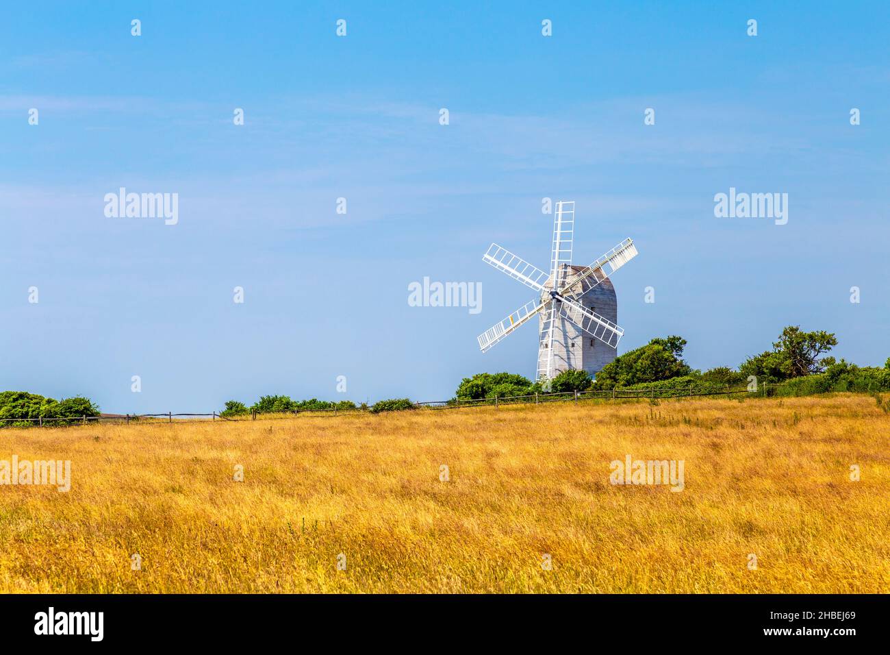 White wooden windmill in a field - Ashcombe Windmill in Kingston near Lewes, South Downs National Park, England, UK Stock Photo