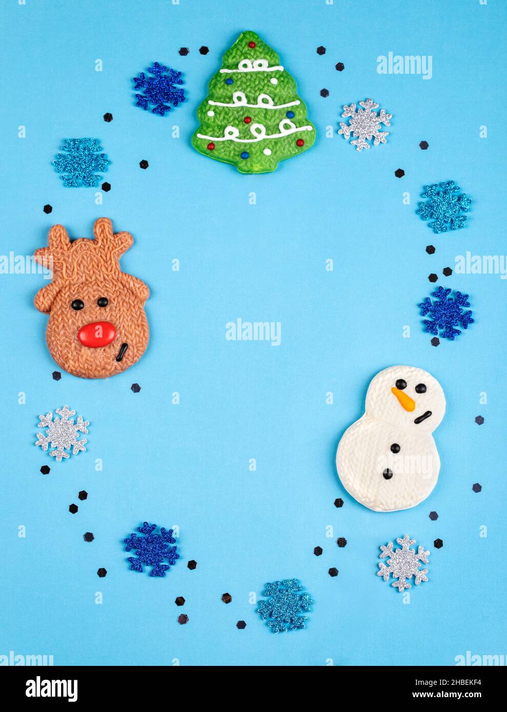 Christmas snowman, Christmas tree and reindeer chocolates with  snowflake decorations Stock Photo