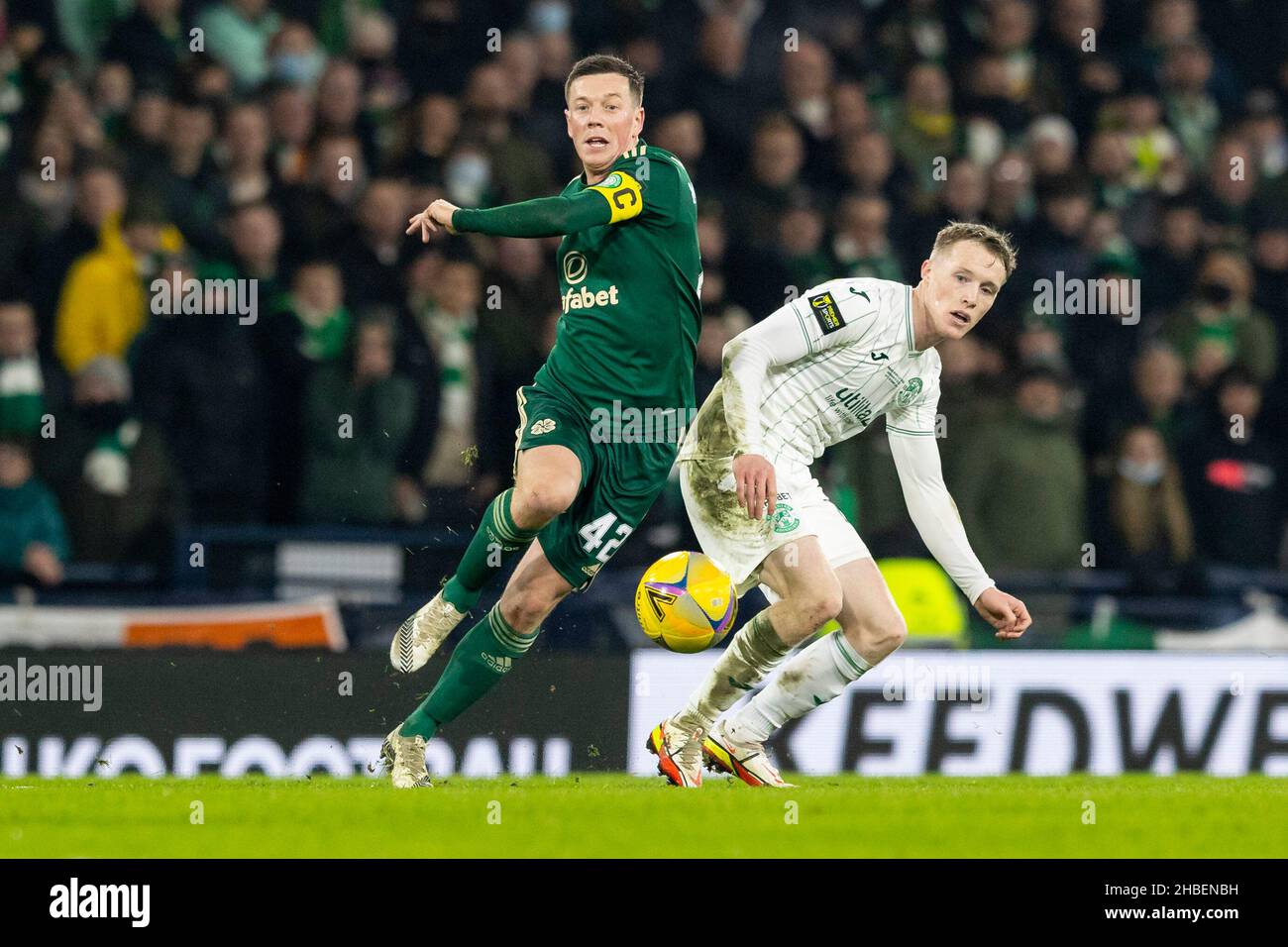 Hampden Park, Glasgow, UK. 19th Dec, 2021. Scottish League Cup final, Hibernian versus Celtic: Callum McGregor of Celtic and Jake Doyle-Hayes of Hibernian compete for possession of the ball Credit: Action Plus Sports/Alamy Live News Stock Photo