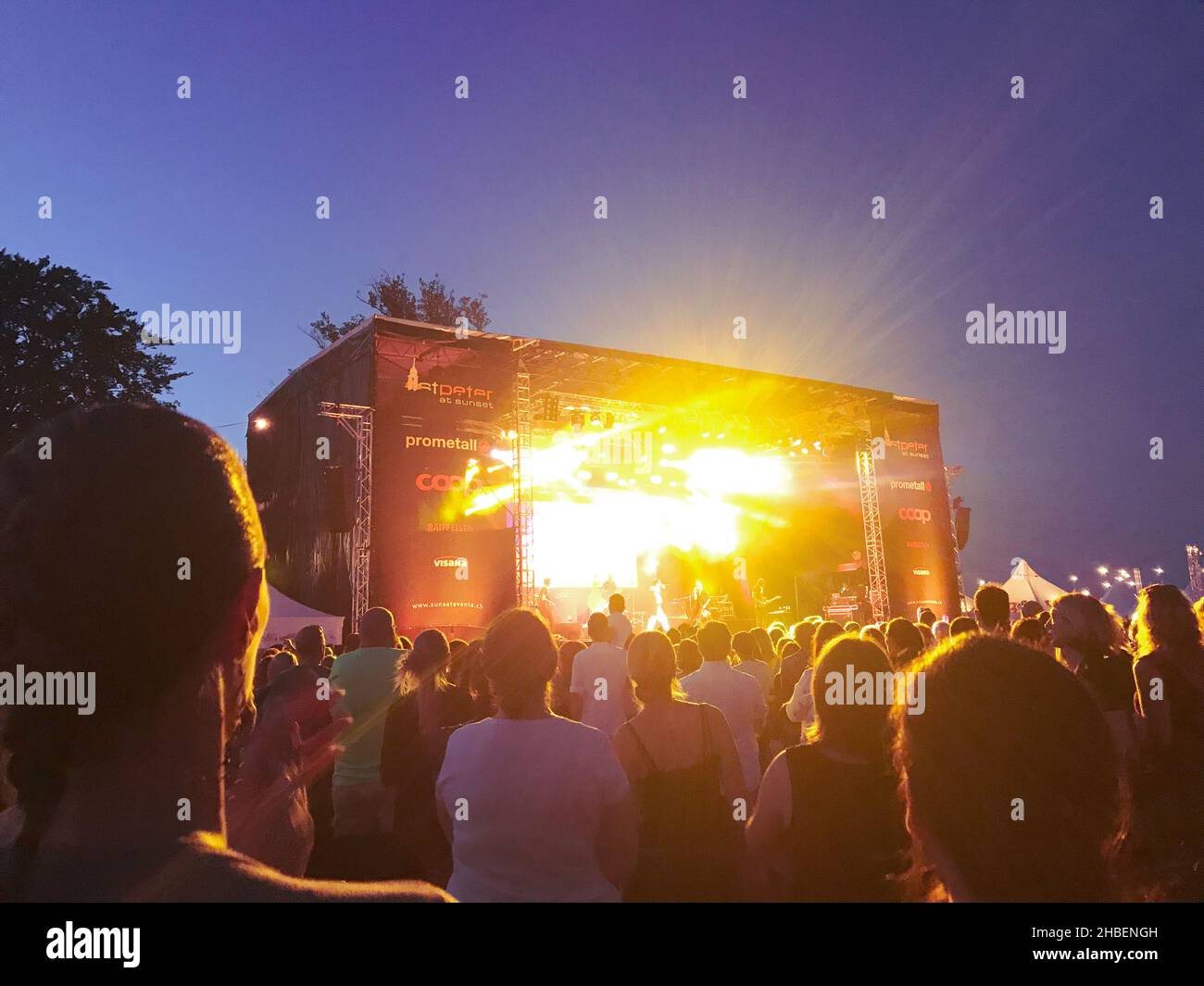 Openair festival with lights and silouhettes of the crowd Stock Photo