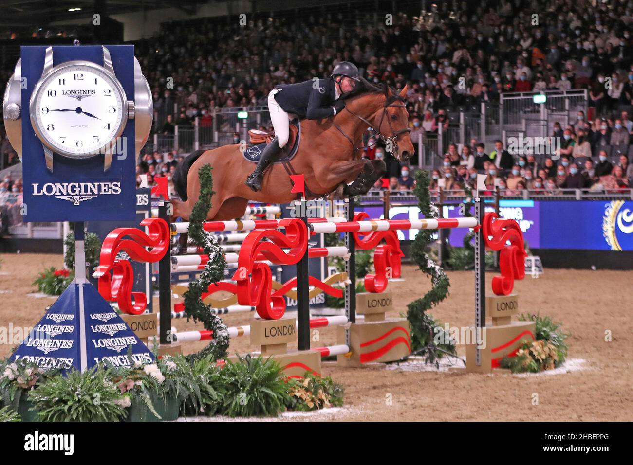 The London International Horse Show, Sunday 19th December: The Longines FEI Jumping World Cup Harry Charles riding Stardust wins The Longines FEI Jumping World Cup Stock Photo