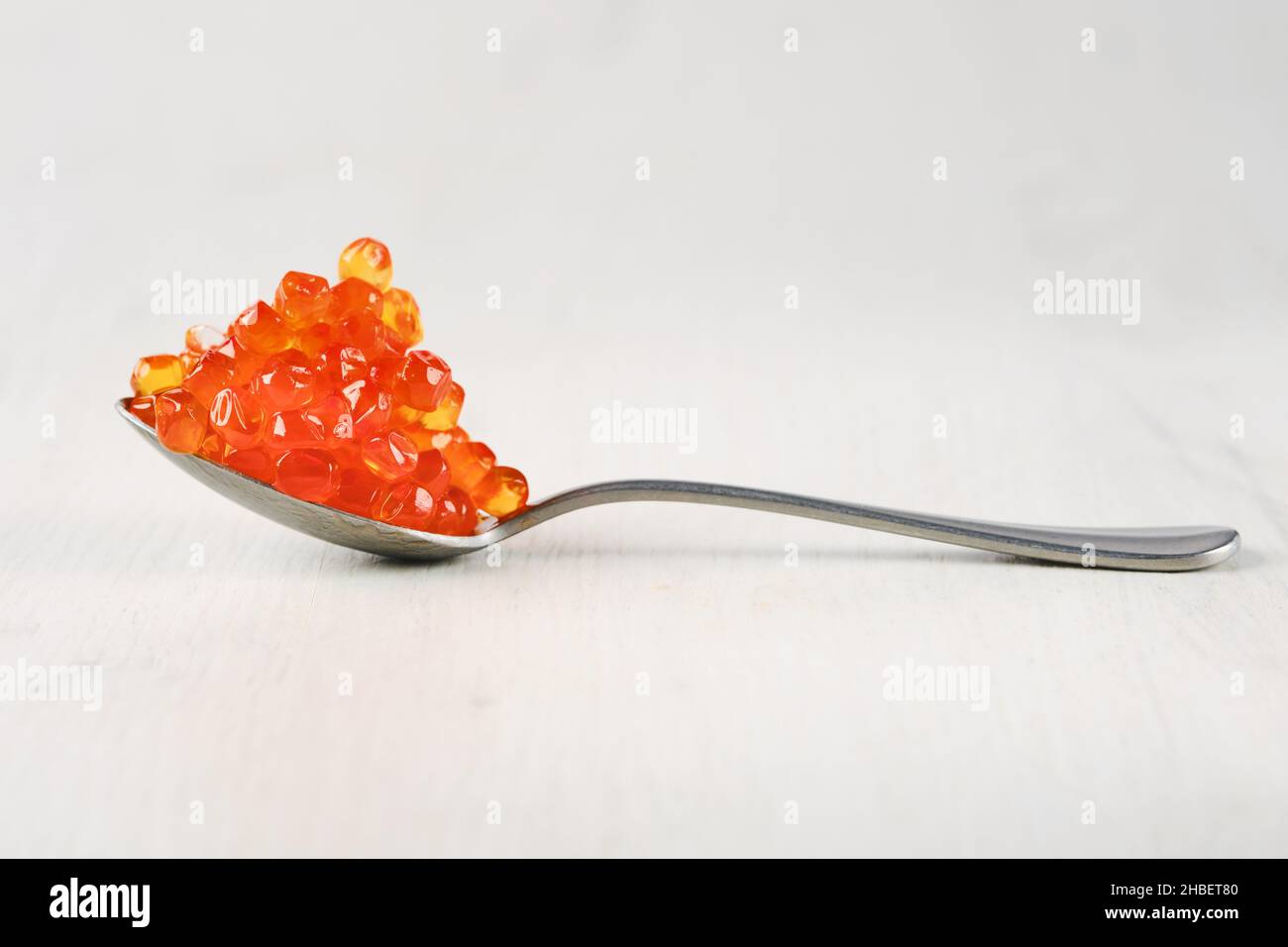 Spoon with salmon red caviar. Stock Photo