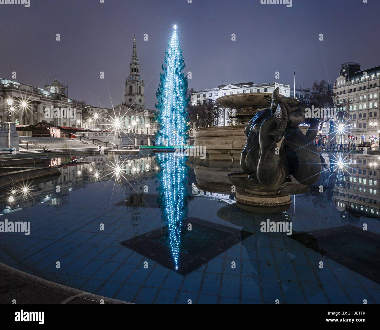 Christmas in Trafalgar Square, with the reflection of the giant