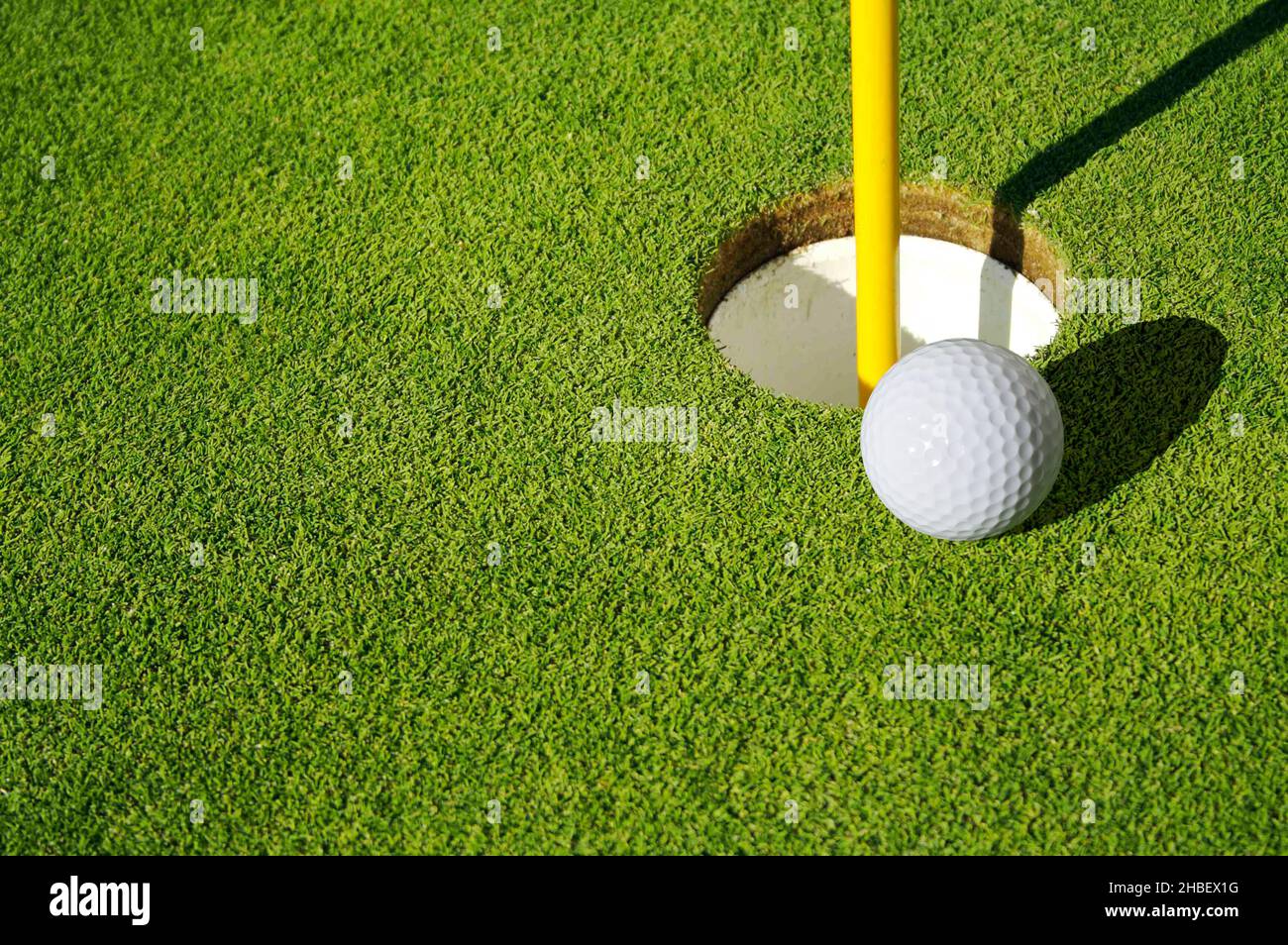 Close-up of Golf Course Green, Flag Pin and Ball Stock Photo - Alamy