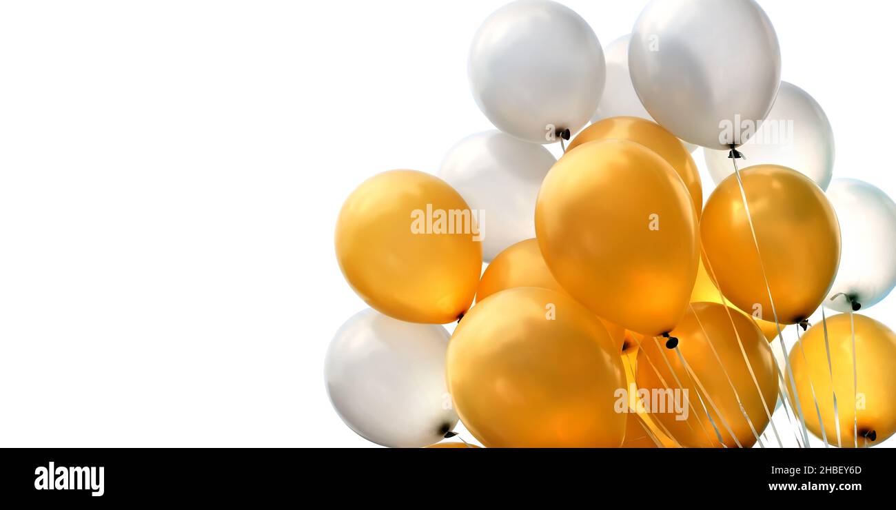 bunch of golden and silver metallic rubber air balloons isolated on white background, banner format Stock Photo