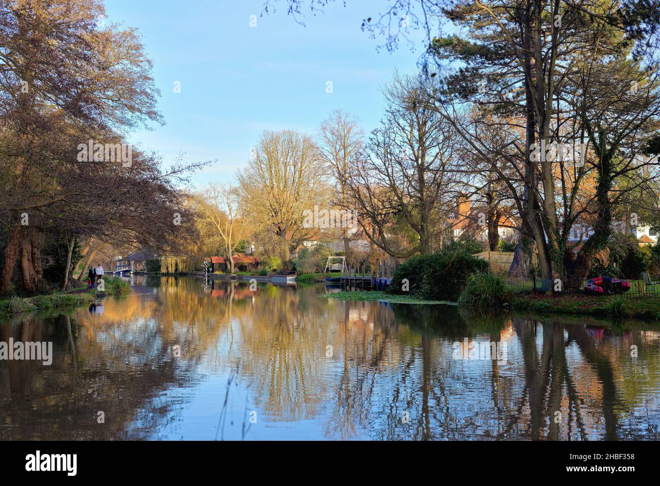A quiet backwater of the River Wey navigation canal at Weybridge on a sunny winters day Surrey England UK Stock Photo