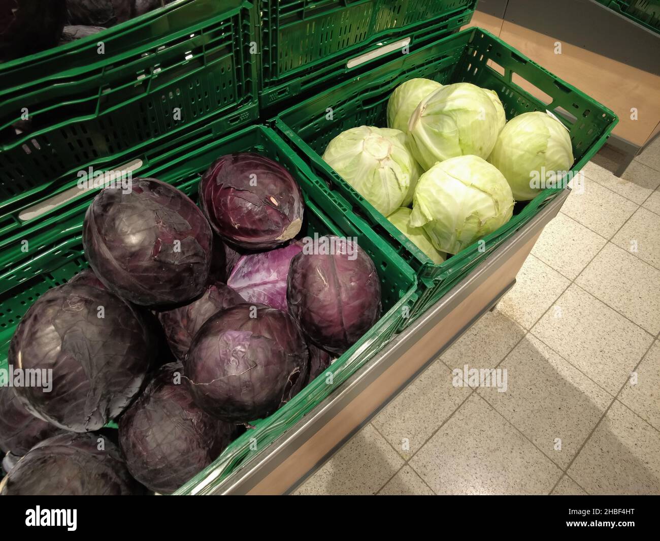 Red cabbage and white cabbage in transport boxes Stock Photo - Alamy