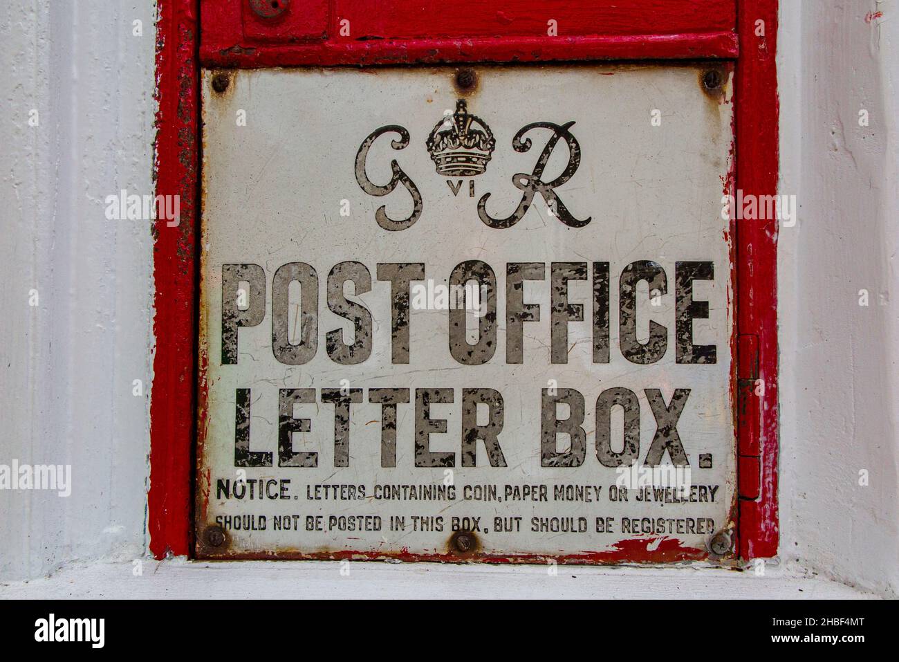 A traditional old fashioned post box from the reign of George VI inCharing, Kent. Stock Photo