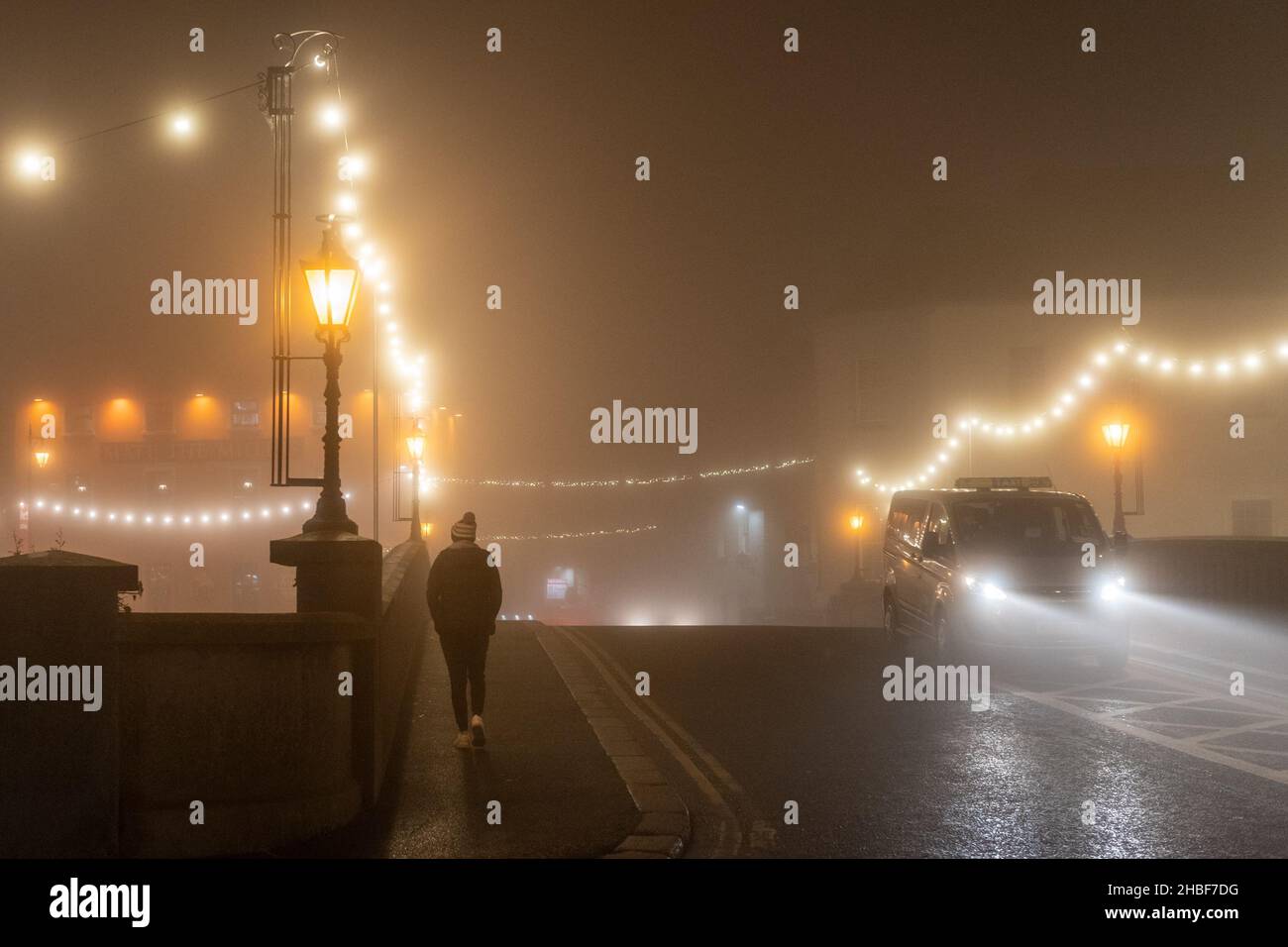Kilkenny, Co. Kilkenny, Ireland. 19th Dec, 2021. A heavy fog enveloped Kilkenny this evening on the eve of new COVID-19 restrictions. Pubs and restaurants must close at 8pm from tomorrow night until 31st January. Credit: AG News/Alamy Live News Stock Photo