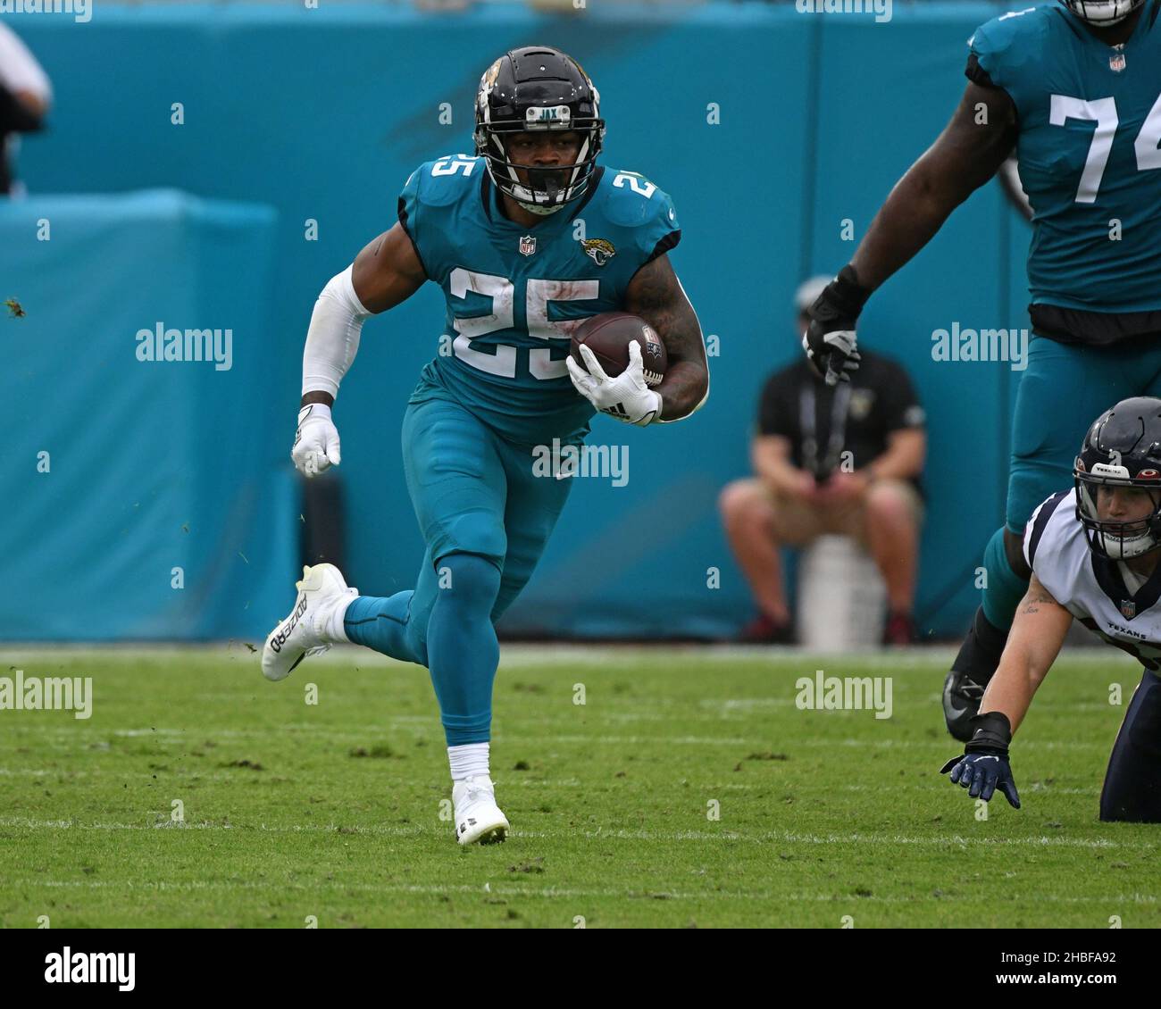 Jacksonville, United States. 19th Dec, 2021. Running Back James Robinson runs for yardage as the Texans compete against the Jaguars at the TIAA Bank Field in Jacksonville, Florida on Sunday, December 19, 2021. The Texans defeated the Jaguars 30 - 16. Photo by Joe Marino/UPI Credit: UPI/Alamy Live News Stock Photo