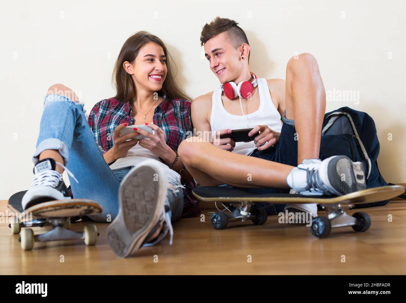 Girl and boy playing games online Stock Photo