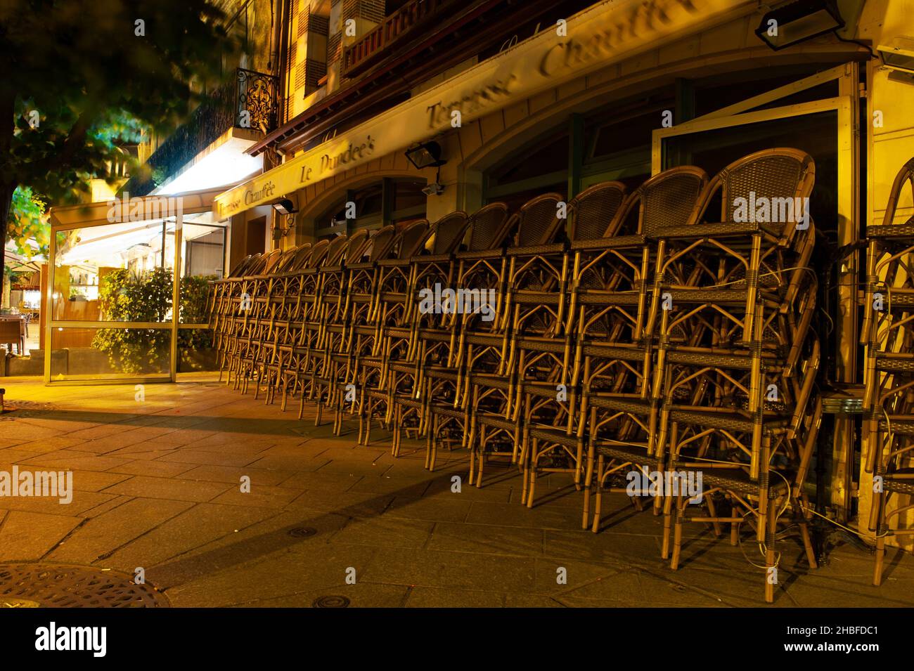 Stacked Chairs at Night Stock Photo