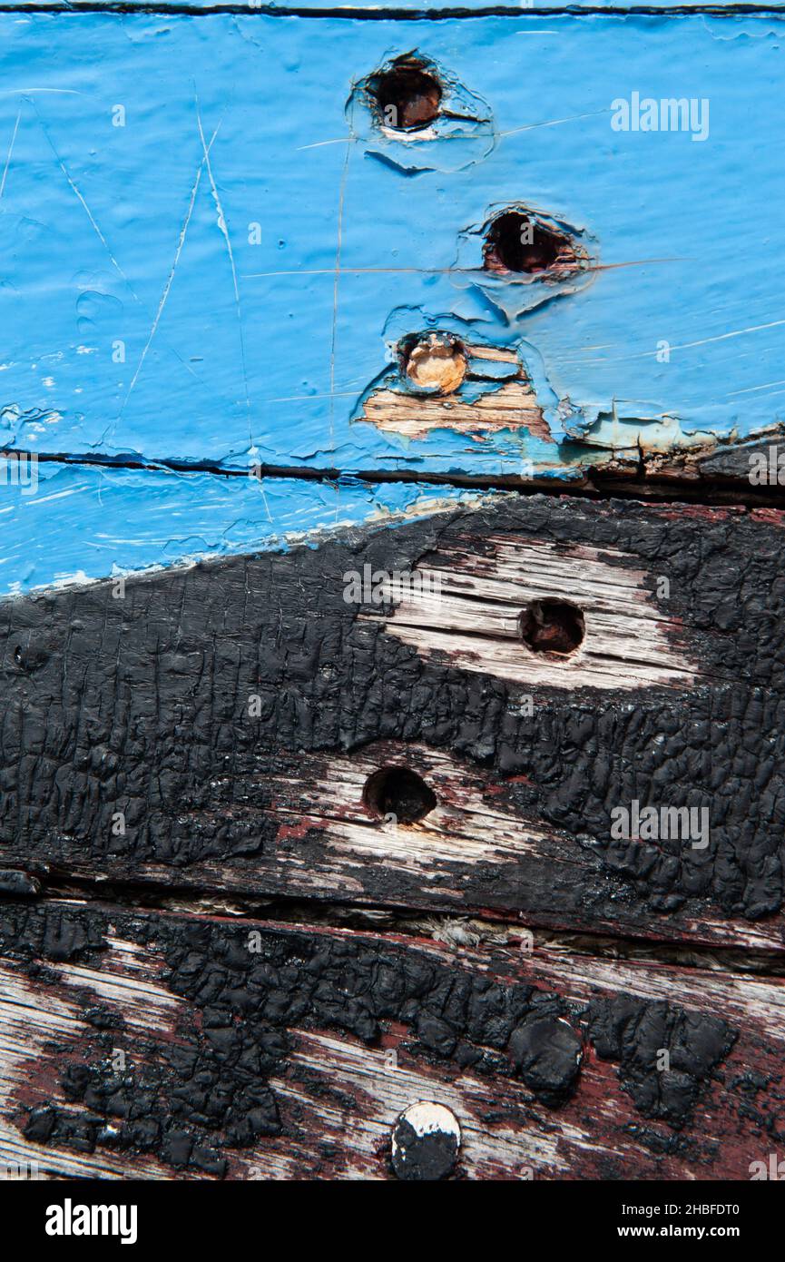 Closeup of some bolt holes on an old boat Stock Photo