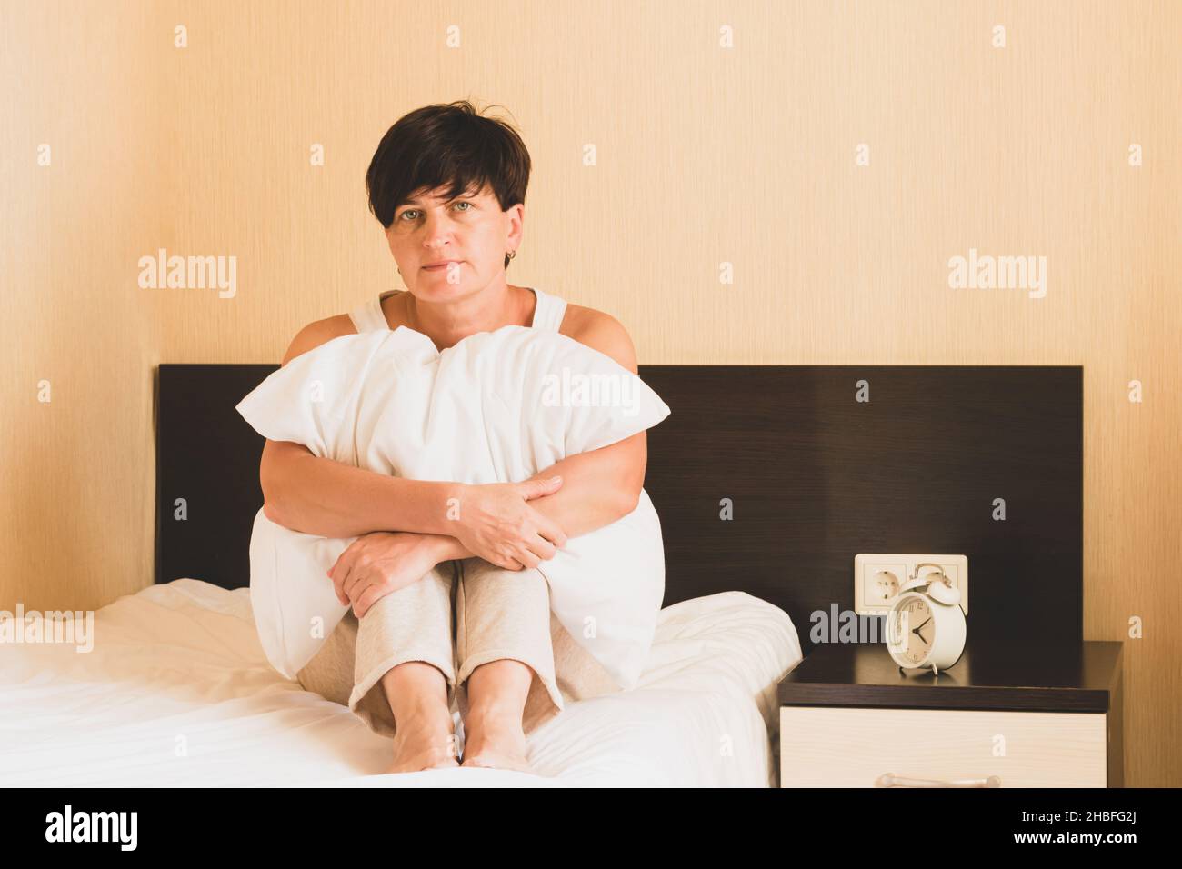 Middle aged woman crying bed hi-res stock photography and images - Alamy