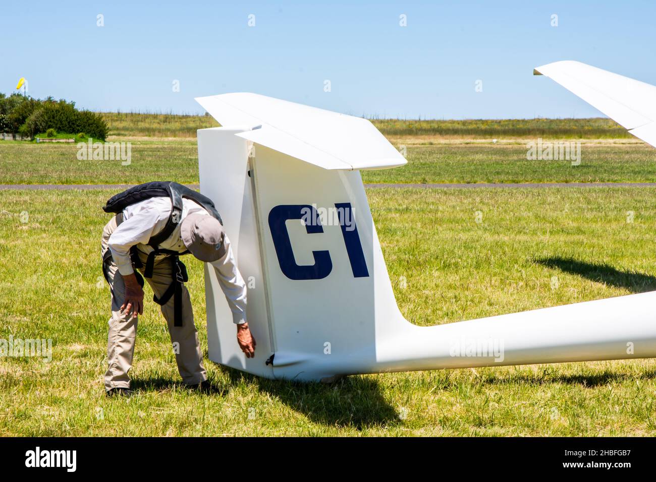 Pre flight checks by pilot on a Schleicher AS K21 glider. Stock Photo