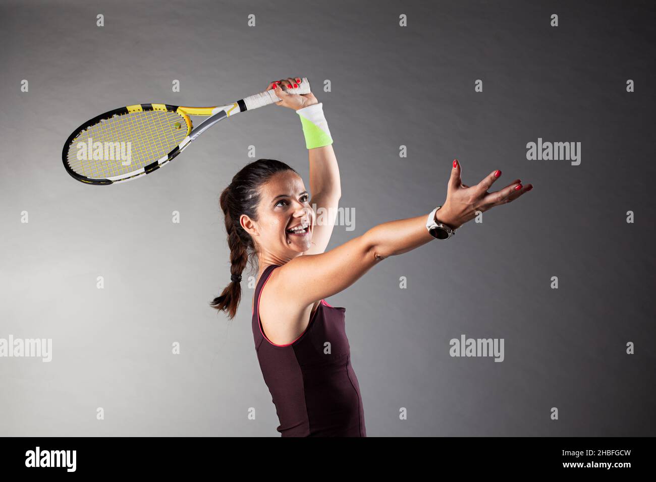 Professional female tennis player. Girl swinging racket Stock Photo - Alamy