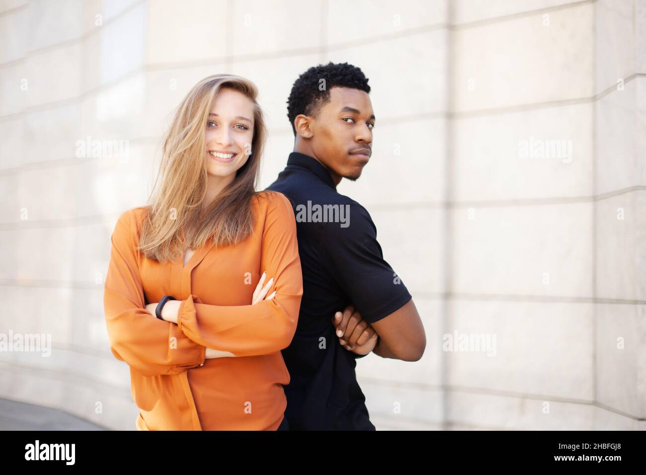 successful business couple standing in front of office center Stock ...